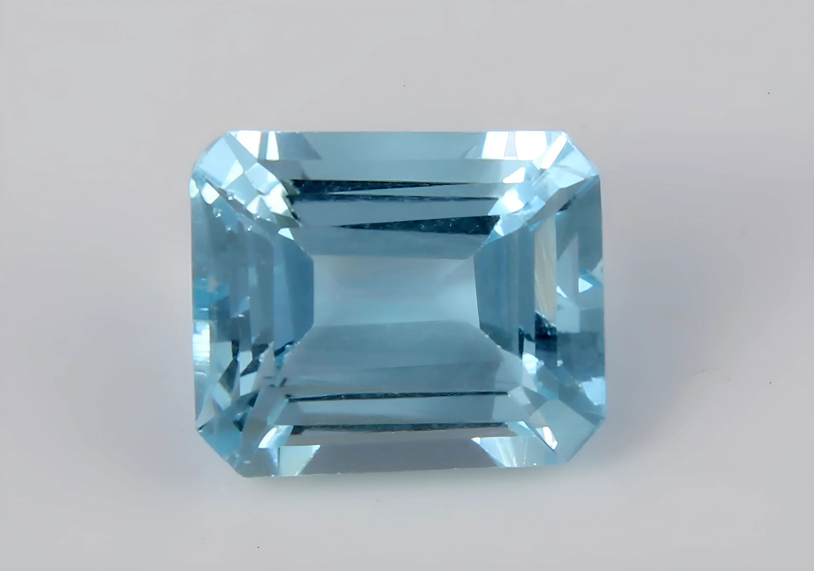 Aquamarine, 1.89 CT: Title: Aquamarine, 1.89 CT Description: Species: Beryl Variety: Aquamarine Shape: Emerald Cut Measurements: 8.12x6.87x4.80mm Colour: Blue Certificate: Yes (GSI/