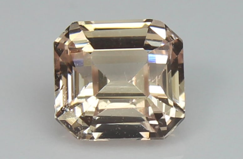 Peach Sapphire 1.25 CT: Title: Peach Sapphire 1.25 CT Description: Species: Corundum Variety: Sapphire Shape: Square Emerald Cut Measurements: 5.91x5.53x3.94mm Colour: Light brown 