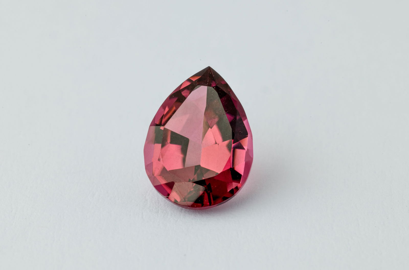 Reddish Pink Tourmaline, 1.70 Ct: Title: Reddish Pink Tourmaline, 1.70 Ct Description: Species: Tourmaline Variety: Rubellite Shape: Pear Measurements: 9.37x6.88x4.40mm Colour: Red