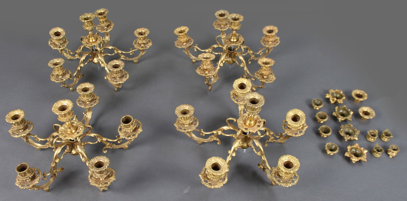 Ornate Gilt Metal Girandole Candle Holders: Title: Ornate Gilt Metal Girandole Candle Holders Description: Collection of Ornate Gilt Metal Girandole Candle Holders A set of four gilt metal girandole candle holders in a Rococo-style