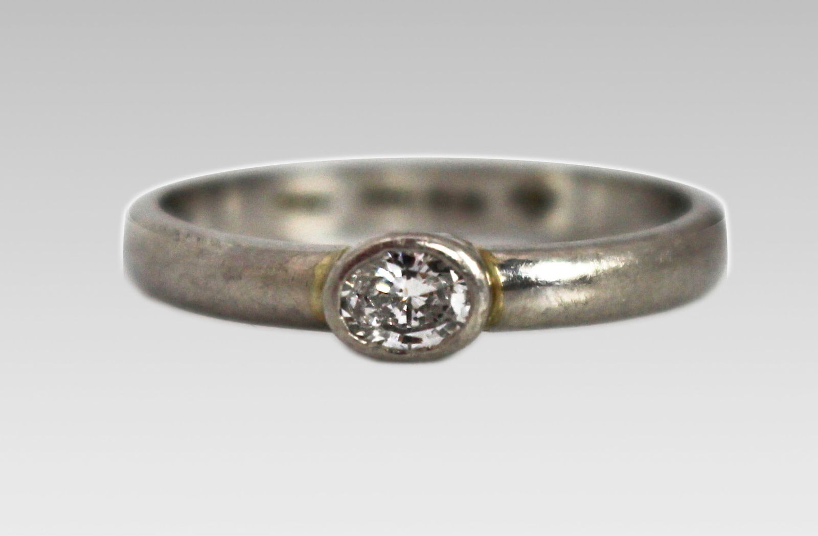 Vintage Oval Diamond Platinum Ring: Title: Vintage Oval Diamond Platinum Ring Description: Vintage Oval Diamond Platinum Ring Vintage 20th c. Set with oval diamond 0.20 carat Platinum shank, fully hallmarked. Weight 4.7 g 