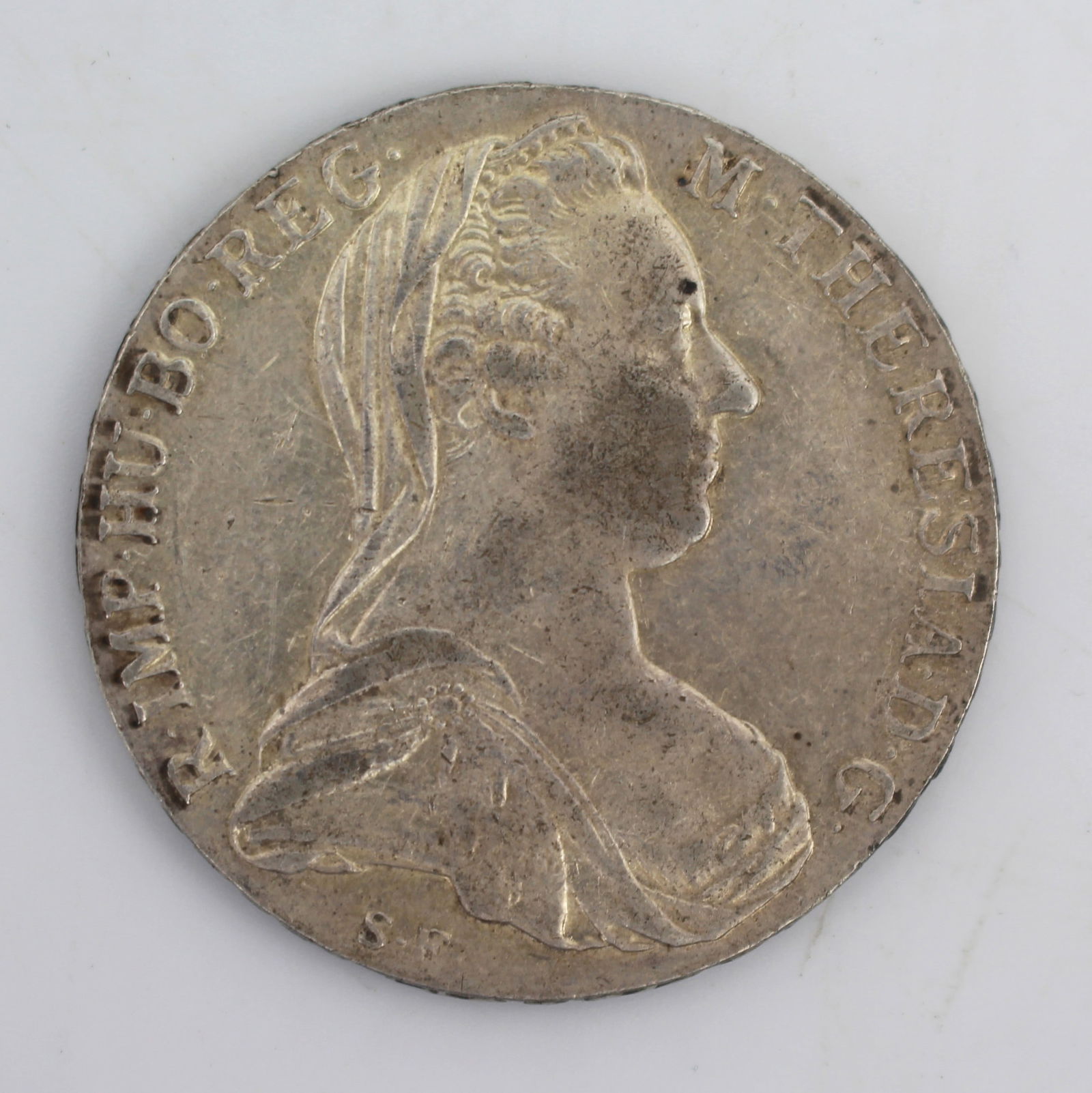 Maria Theresa Thaler – 1780 Restrike: Title: Maria Theresa Thaler – 1780 Restrike Description: Maria Theresa Thaler – 1780 Restrike A Maria Theresa Thaler silver coin, featuring the standard 1780 date, which