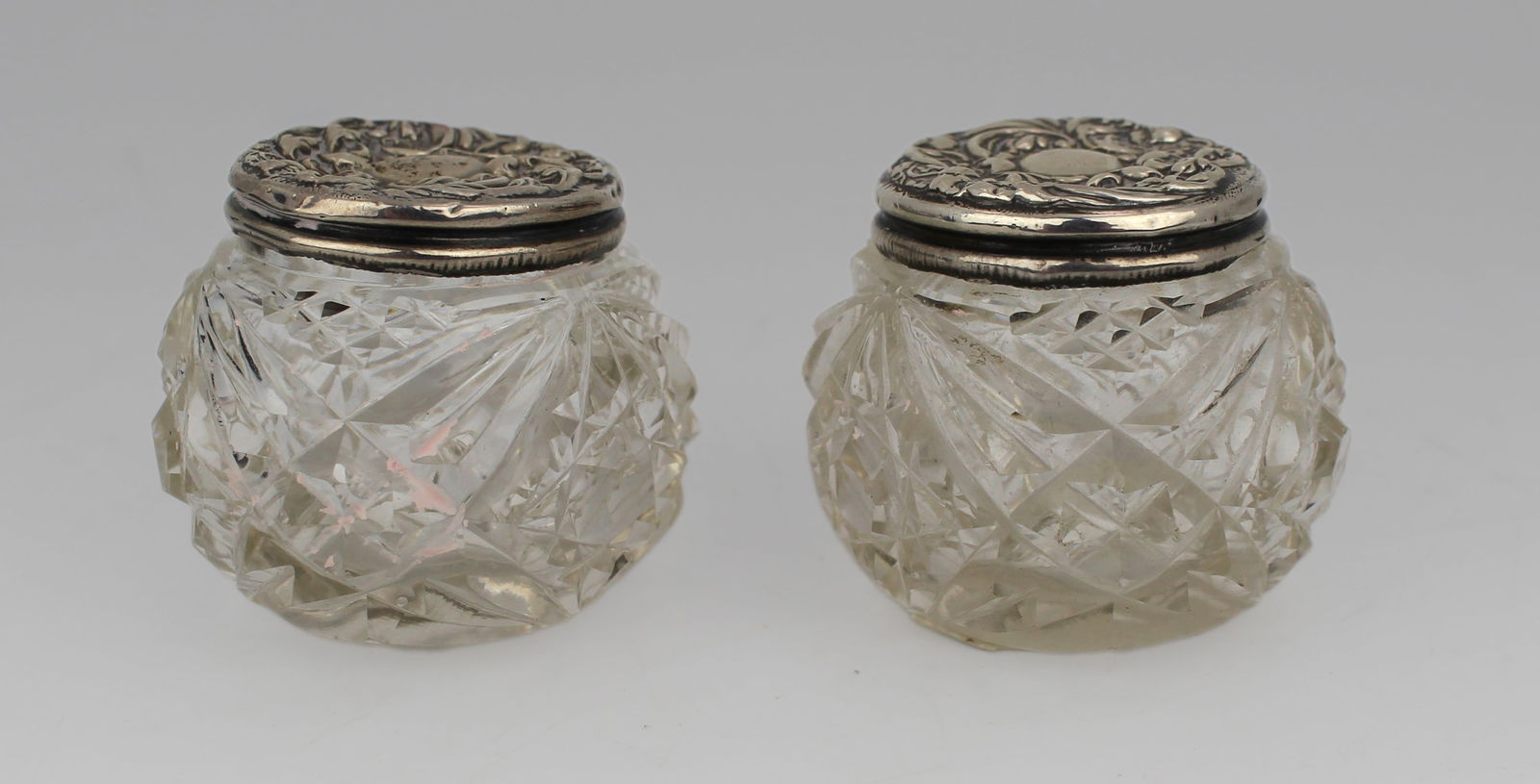 Pair of Cut Glass Silver Topped Pots Birmingham 1907 Henry Hobson: Title: Pair of Cut Glass Silver Topped Pots Birmingham 1907 Henry Hobson Description: Pair of Cut Glass Silver Topped Pots Birmingham 1907 Henry Hobson. Each measures 4.5 x 4.5 x 4 (height) cm 