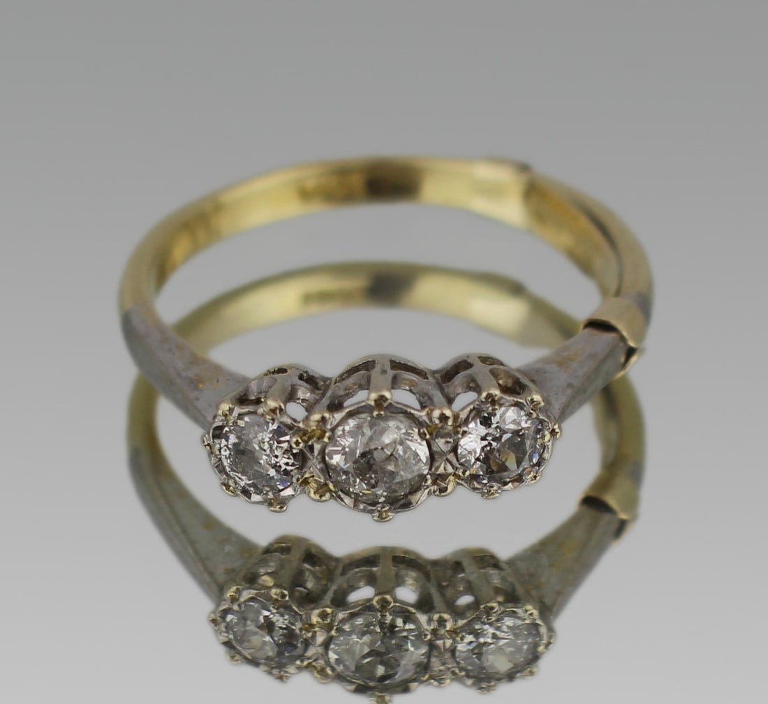 Three Stone Diamond 18ct Ring: Title: Three Stone Diamond 18ct Ring Description: Vintage Three Stone Diamond 18ct Ring Set with three diamonds. The shank of18ct gold with platinum shoulders. The ring currently with a 9ct