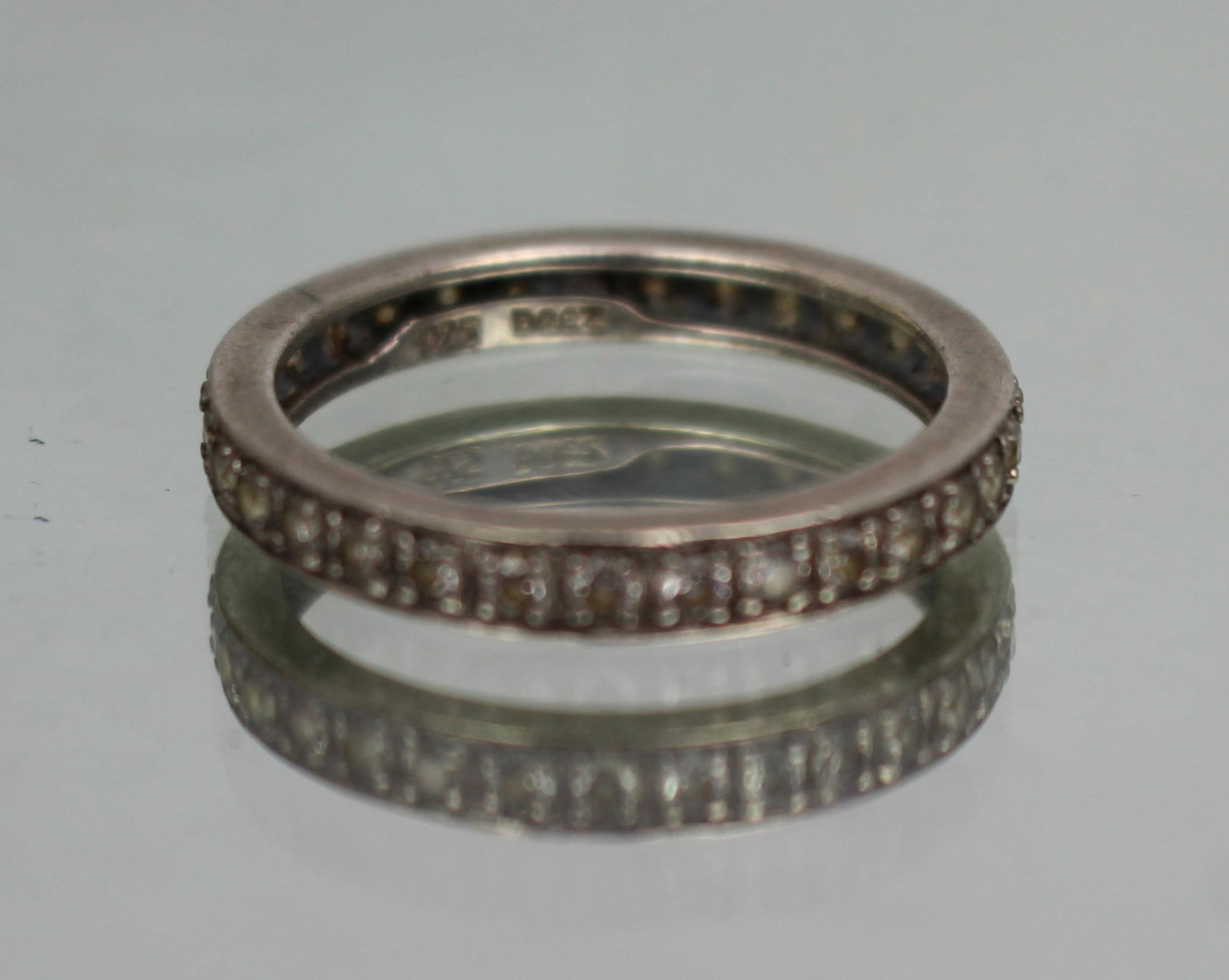 Vintage Silver Eternity Ring: Title: Vintage Silver Eternity Ring Description: Vintage Silver Eternity Ring Stamped 925 CZ set Weight 3.2 g. Ring size T Good pre-owned condition. Condition: Used Delivery option: