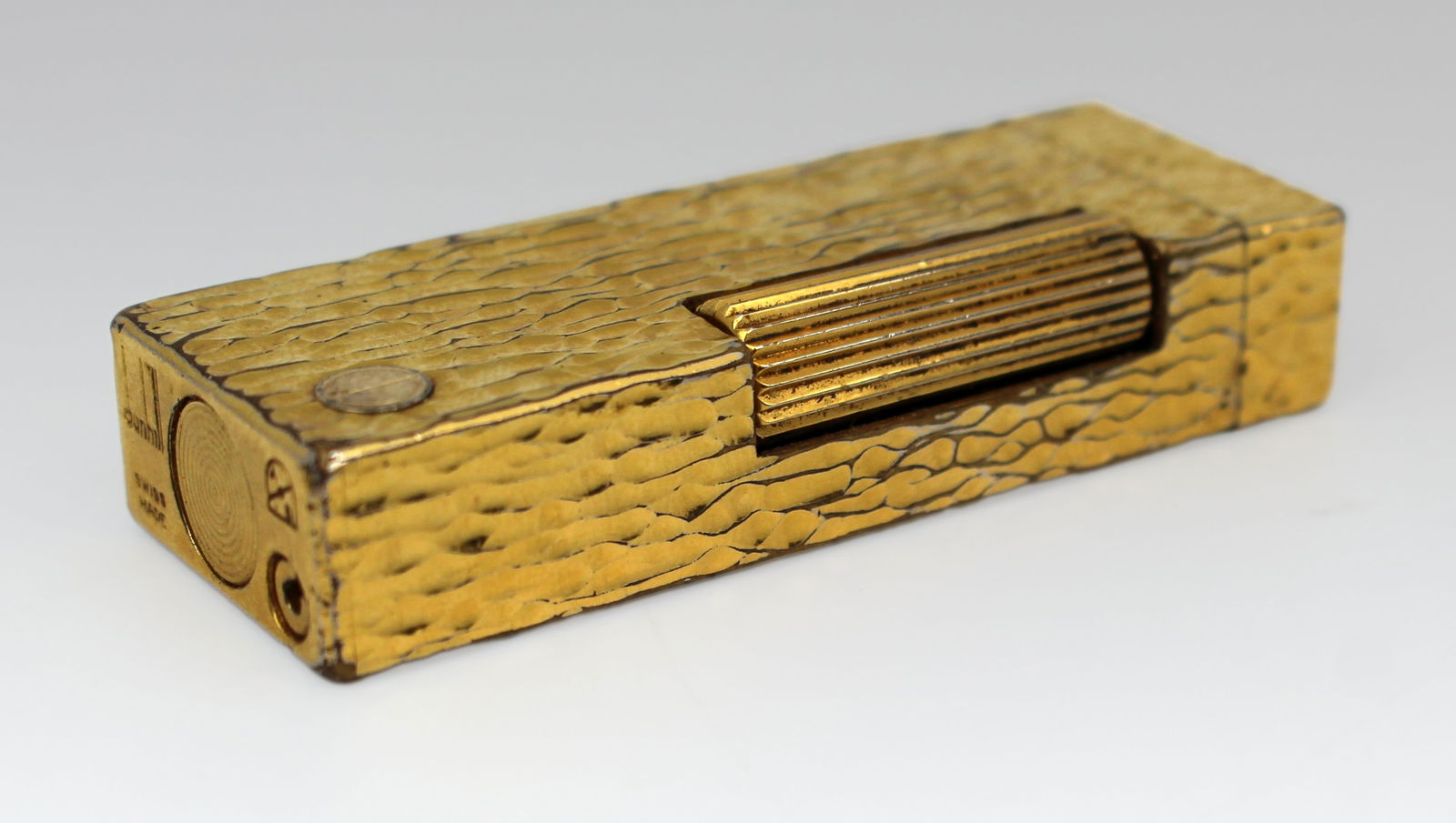 Dunhill Swiss-Made Gold-Plated “Bark” Finish Lighter, c.1965: Title: Dunhill Swiss-Made Gold-Plated “Bark” Finish Lighter, c.1965 Description: Vintage Dunhill Swiss-Made Gold-Plated Lighter – Textured Bark Finish, c.1965 A vintage