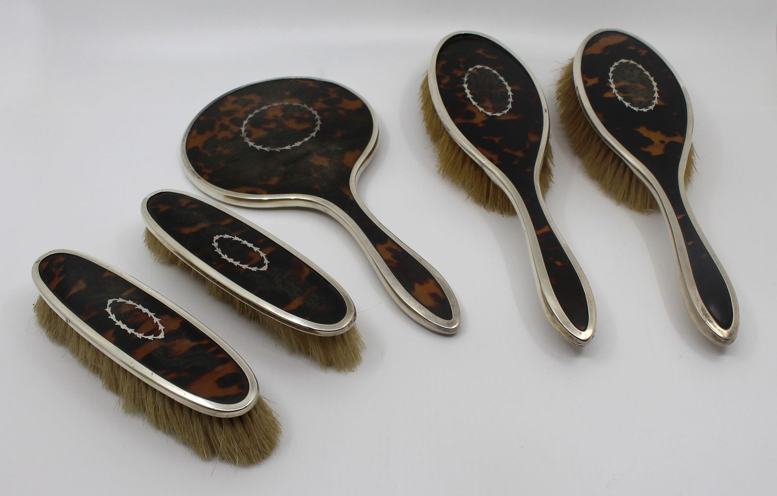 English Five Piece Silver Vanity Brush Set 1923: Title: English Five Piece Silver Vanity Brush Set 1923 Description: Five-Piece Art Deco Sterling Silver & Faux Tortoiseshell Vanity Set, Birmingham 1923 An elegant five-piece English vanity