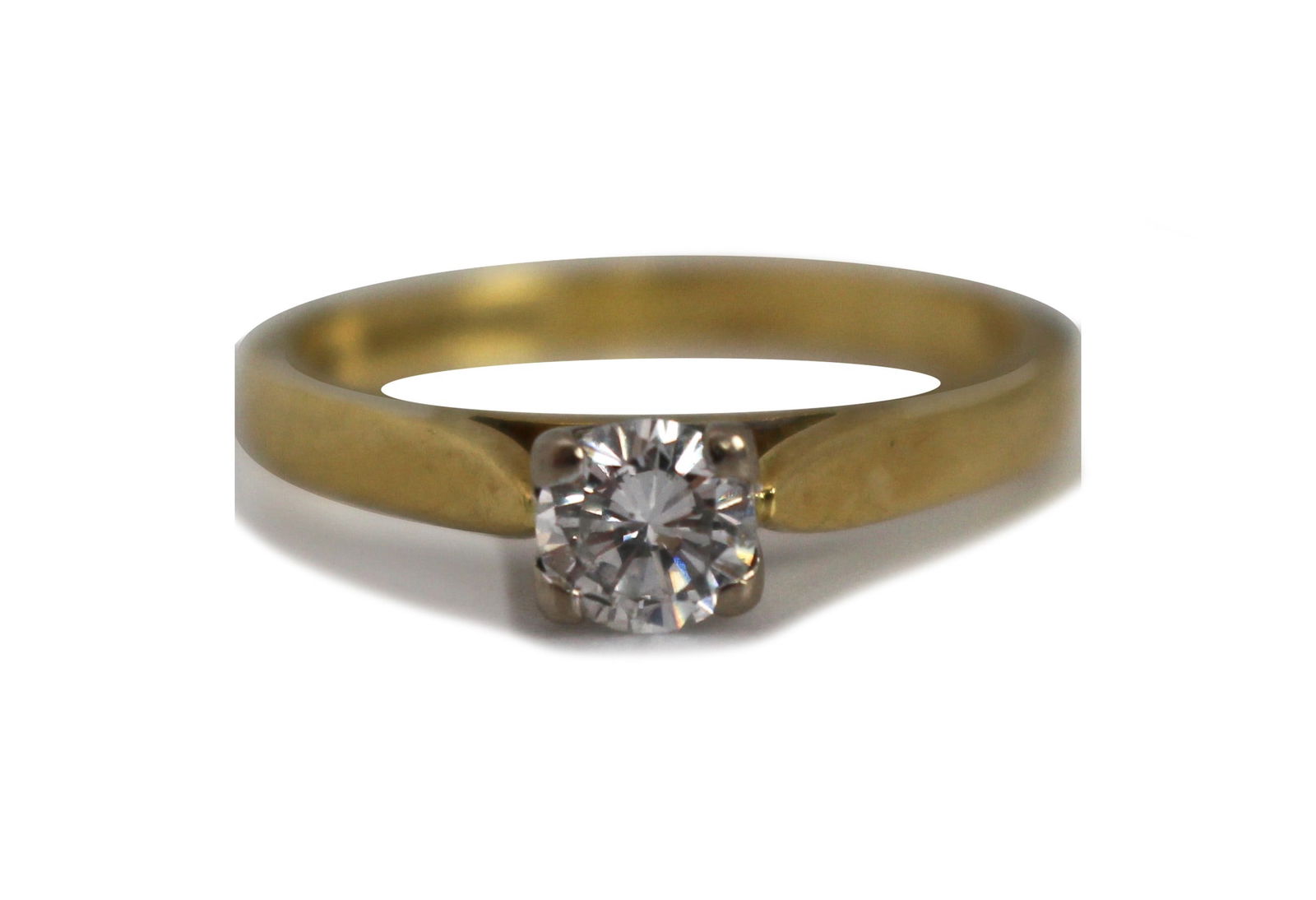 Diamond Solitaire Ring - 18ct Yellow Gold, 0.42ct Diamond: Title: Diamond Solitaire Ring - 18ct Yellow Gold, 0.42ct Diamond Description: Diamond Solitaire Ring - 18ct Yellow Gold, 0.42ct Diamond This 18ct yellow gold diamond solitaire ring features a
