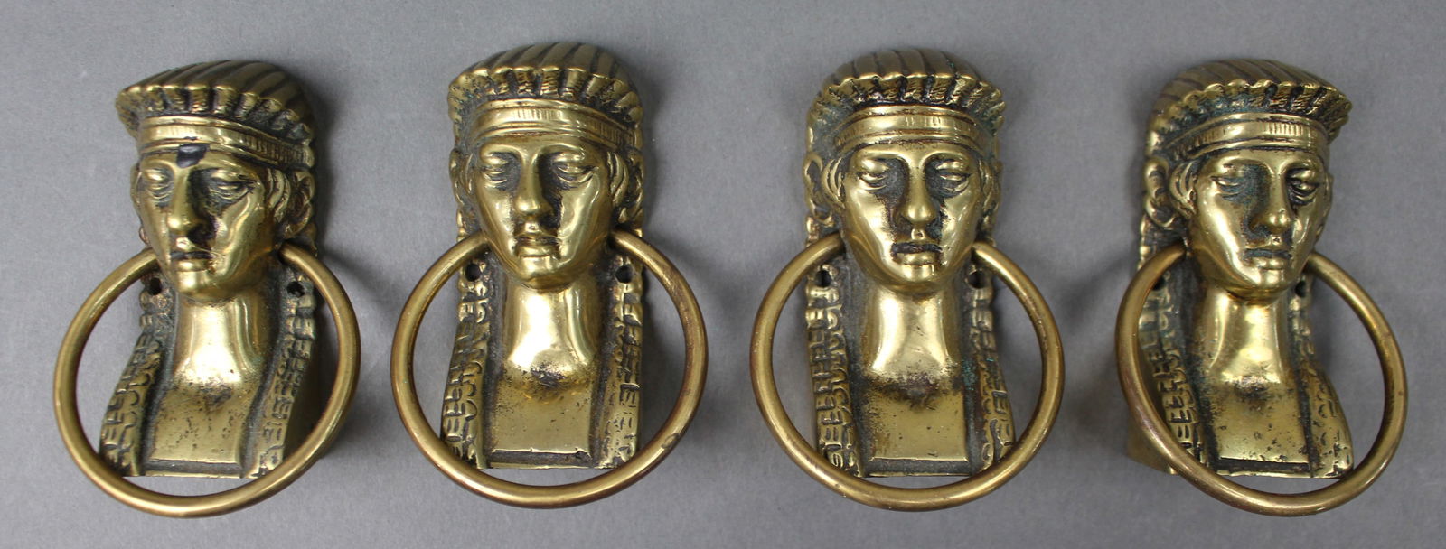 Set of Four Antique Brass Classical Female Head Ring Handles: Title: Set of Four Antique Brass Classical Female Head Ring Handles Description: Set of Four Antique Brass Classical Female Head Ring Handles A set of four antique cast brass ring handles, each