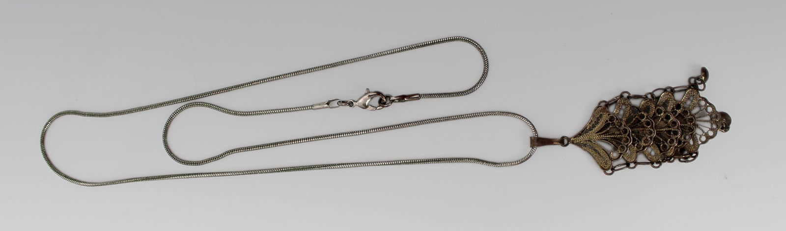 Silver Filigree Pendant on Chain: Title: Silver Filigree Pendant on Chain Description: Silver Filigree Pendant on Chain. Weight: 7.1 g Condition: Used Delivery option: Collection & Delivery Location Category: Antiques