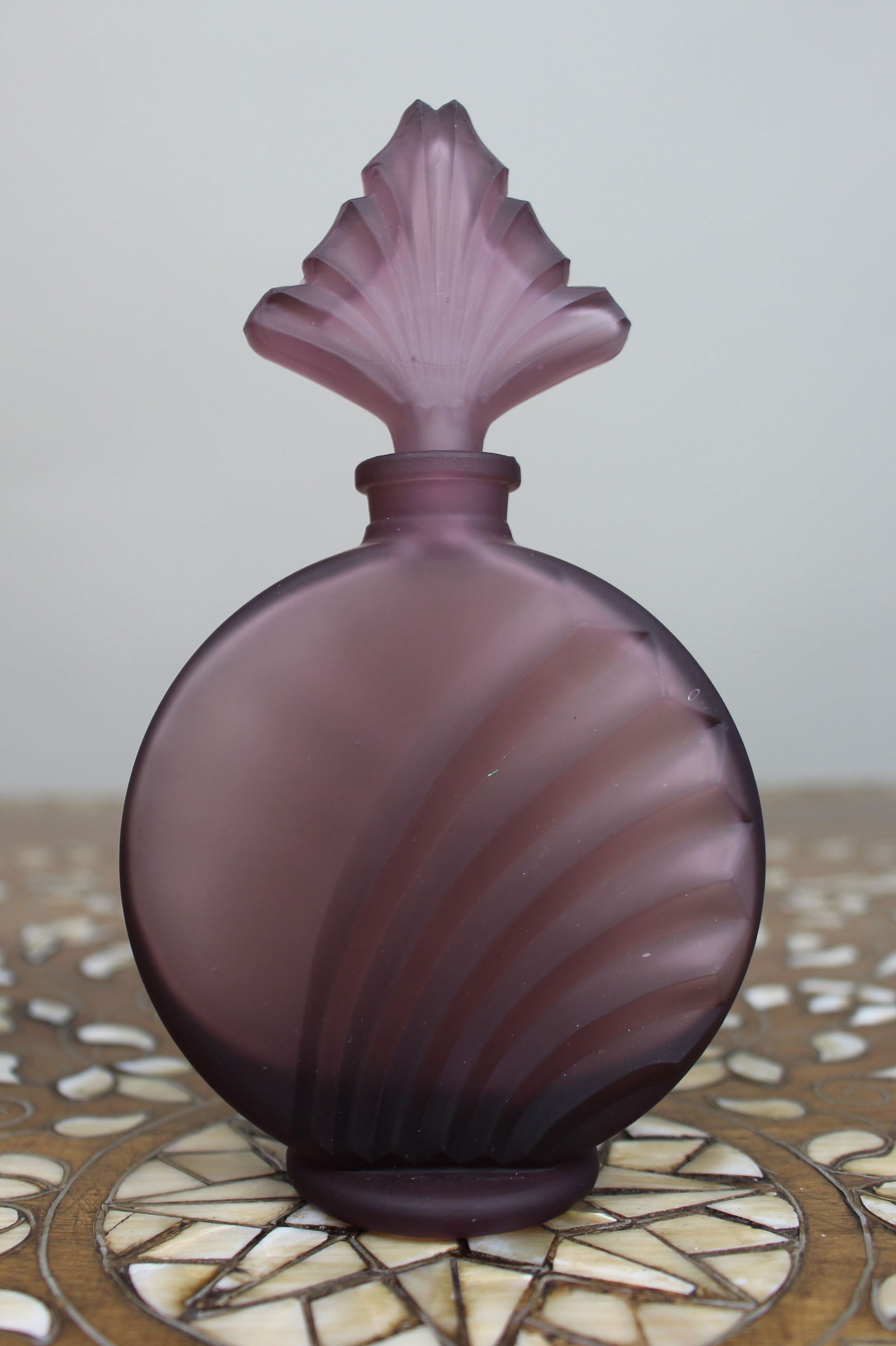 Frosted Purple Glass Scent Bottle: Title: Frosted Purple Glass Scent Bottle Description: Frosted Purple Glass Scent Bottle A decorative modern frosted glass scent bottle in a soft purple tone, of circular form with moulded