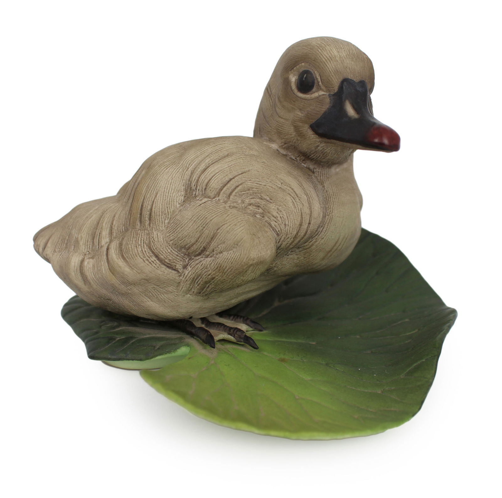 Boehm Cygnet on Leaf: Title: Boehm Cygnet on Leaf Description: Boehm Cygnet on Leaf Boehm, made in England Factory stap to underside Measures 15 x 13 x 10 (height) cm Very good condition; no chips, cracks or