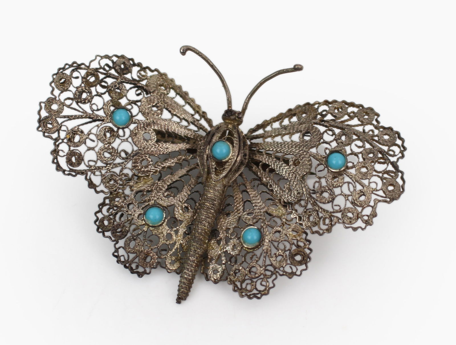 Early 20th Century Silver Filigree Butterfly Brooch with Turquoise Cabochons: Title: Early 20th Century Silver Filigree Butterfly Brooch with Turquoise Cabochons Description: Early 20th Century Maltese Silver Filigree Butterfly Brooch with Turquoise Cabochons A finely