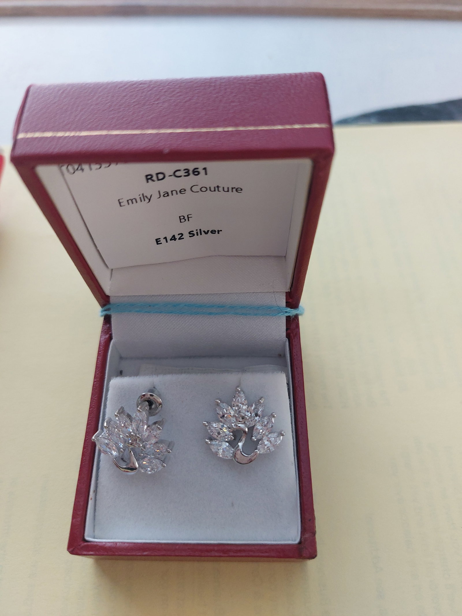 Beautiful Silver Colour Crystal Earrings: Title: Beautiful Silver Colour Crystal Earrings Description: Pair of silver and crystal earrings. Unworn. Richard Design style number E142 Box included