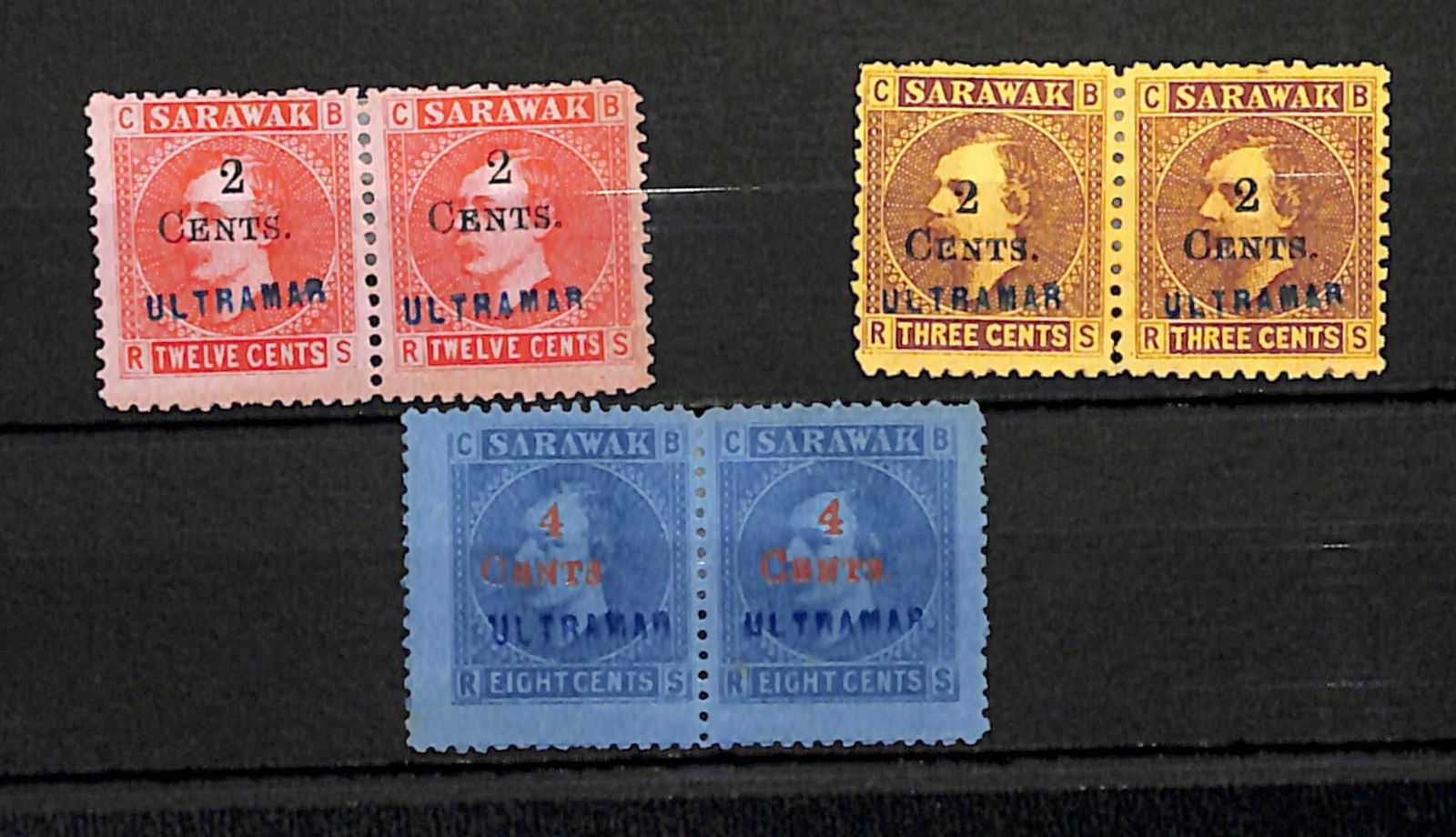 Sarawak 1899: Title: Sarawak 1899 Description: Provisional surcharges, 2c on 3c brown, 2c on 12c red (toned) and 4c on 8c blue, all in unused pairs, distributed as specimen stamps through the U.P.U. and