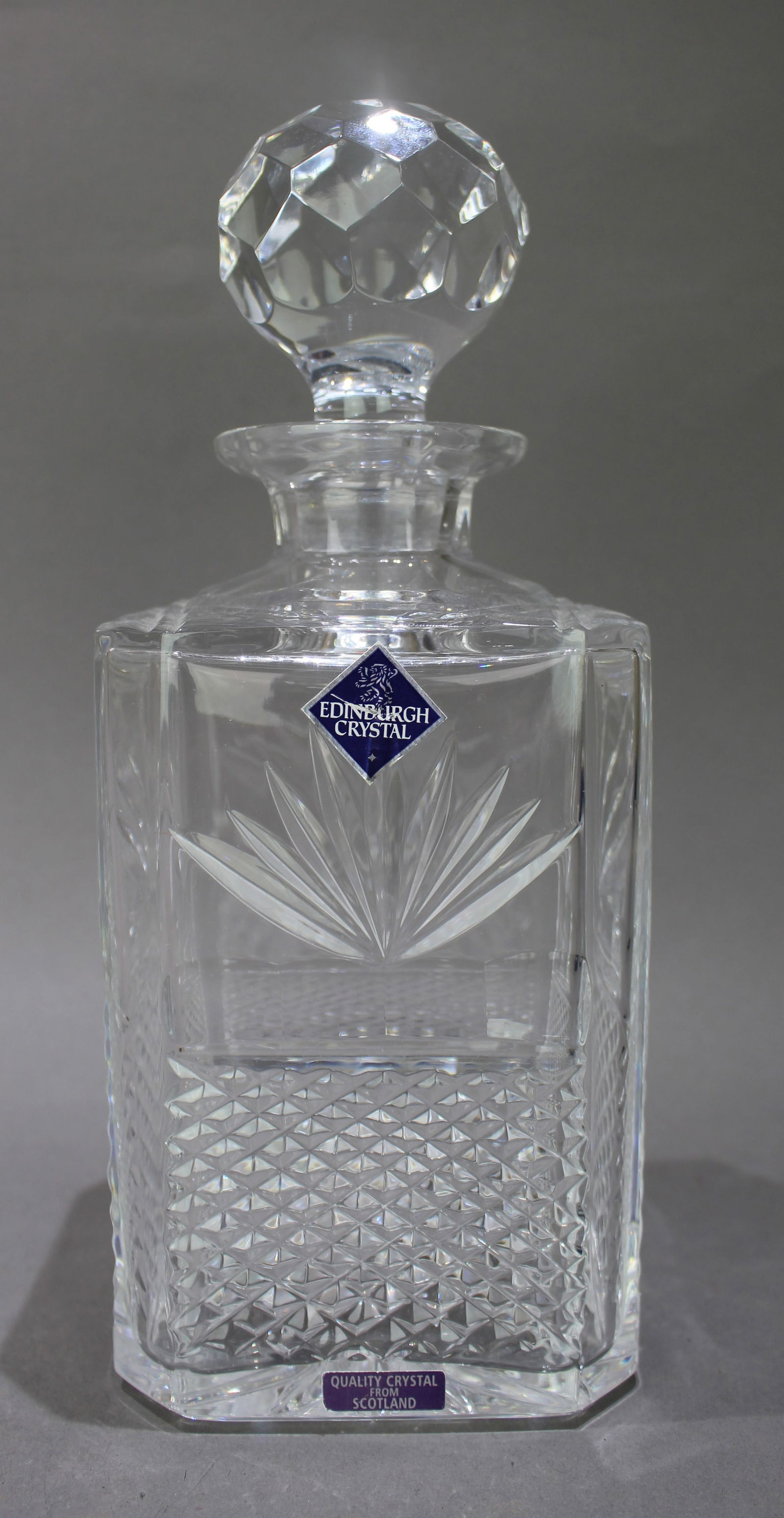 Vintage Edinburgh Crystal Square Shaped Spirit Decanter: Title: Vintage Edinburgh Crystal Square Shaped Spirit Decanter Description: Vintage Edinburgh Crystal Square Shaped Spirit Decanter. Etched factory stamp to underside. Measures 10 x 10 x 25