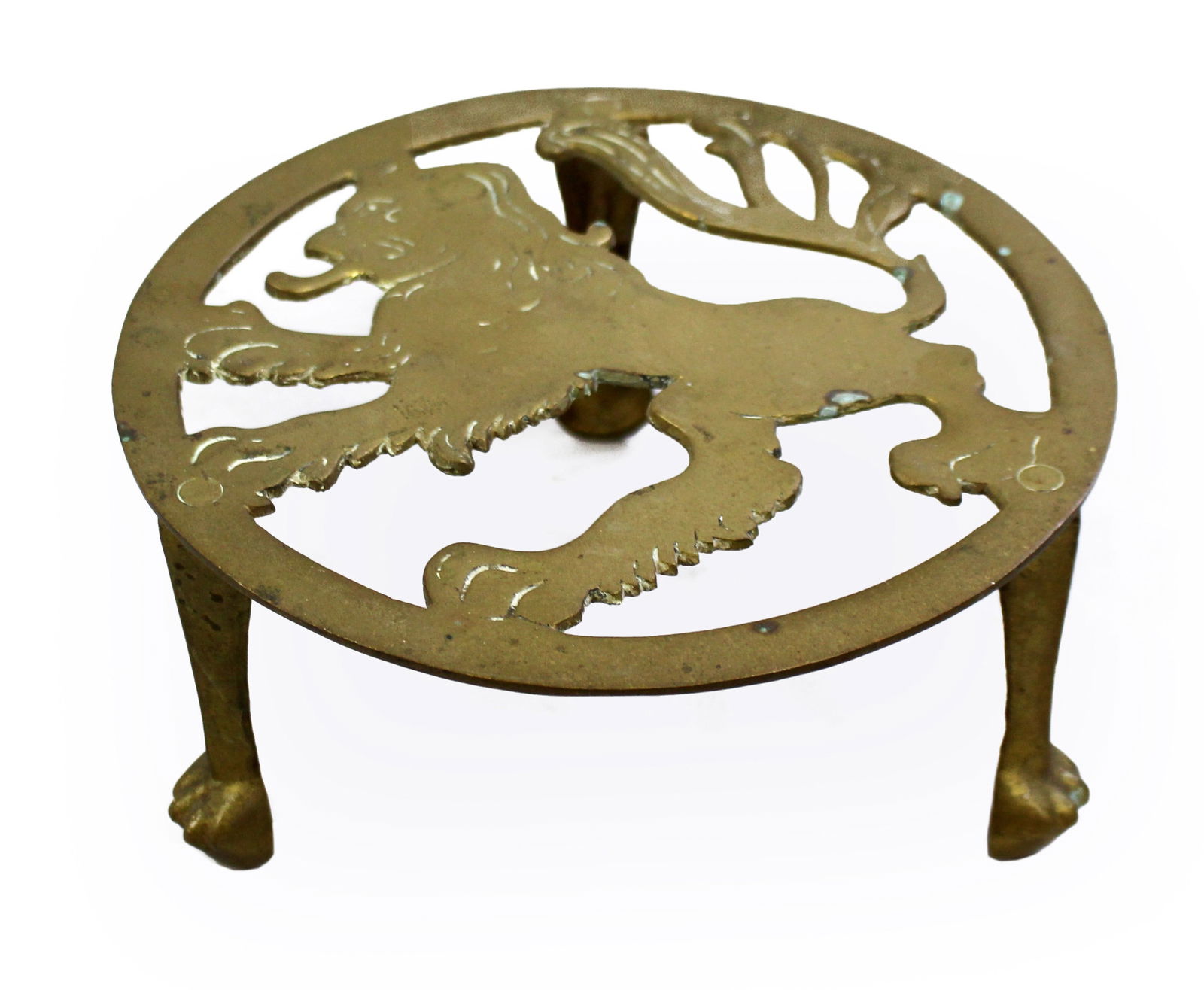 Vintage Brass Lion Form Trivet Stand: Title: Vintage Brass Lion Form Trivet Stand Description: Victorian Brass Trivet with Heraldic Lion Design Circa 1880–1920 A decorative late 19th to early 20th century brass trivet,