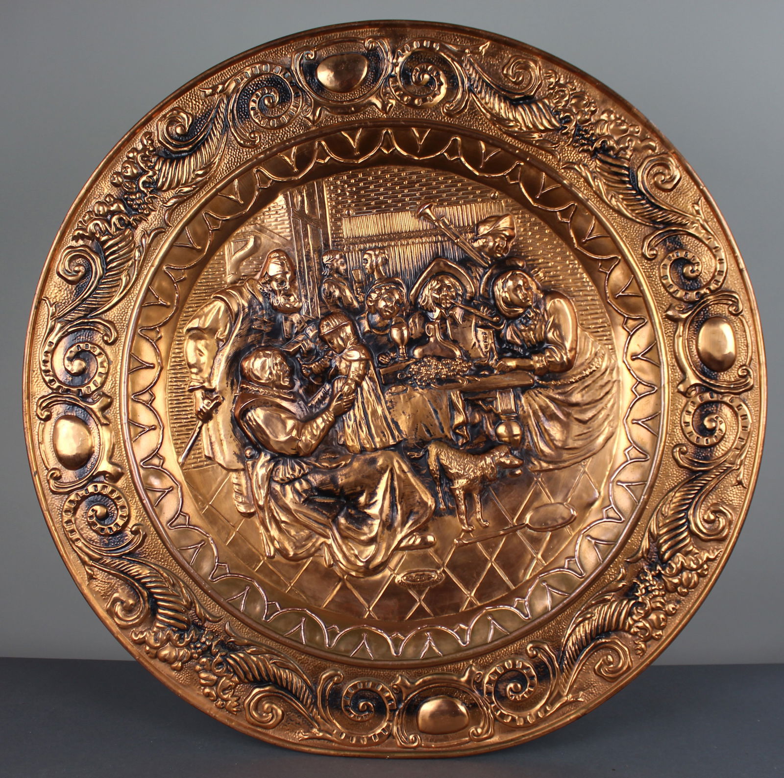 Large English Embossed Copper Tavern Scene Wall Charger: Title: Large English Embossed Copper Tavern Scene Wall Charger Description: Large English Embossed Copper Tavern Scene Wall Charger A large decorative embossed copper wall charger depicting a