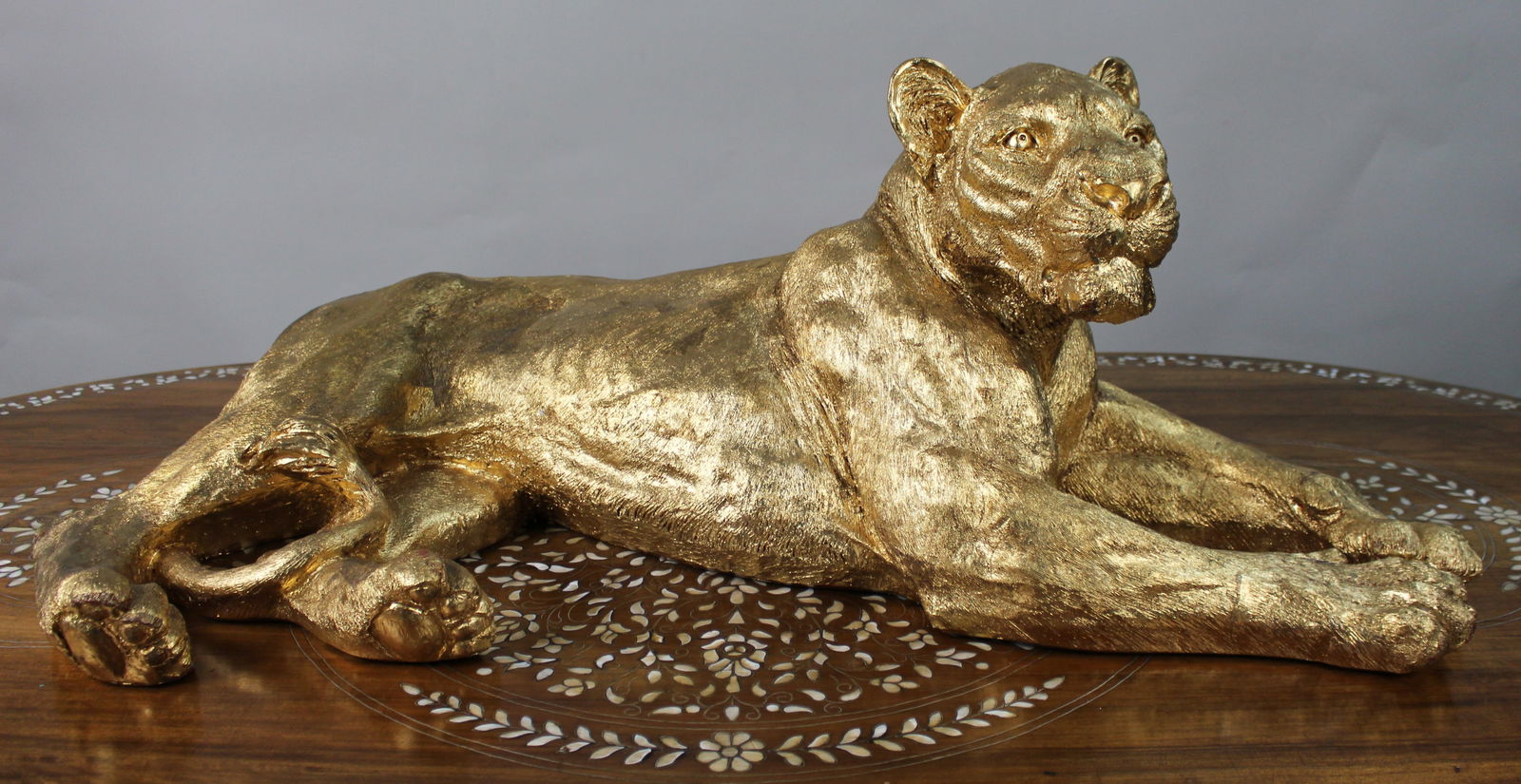 Large Reclining Lioness Sculpture Resin with Hand-Applied Gold Leaf Finish: Title: Large Reclining Lioness Sculpture Resin with Hand-Applied Gold Leaf Finish Description: Large Reclining Lioness Sculpture Hand-Applied Gold Leaf over Resin Body A striking contemporary
