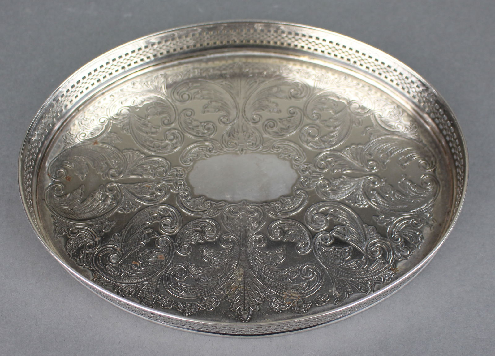 Small Silver Plated Cavalier Galleried Tray: Title: Small Silver Plated Cavalier Galleried Tray Description: Small Silver Plated Cavalier Galleried Tray A decorative small silver plated tray by Cavalier, made in England. The tray features