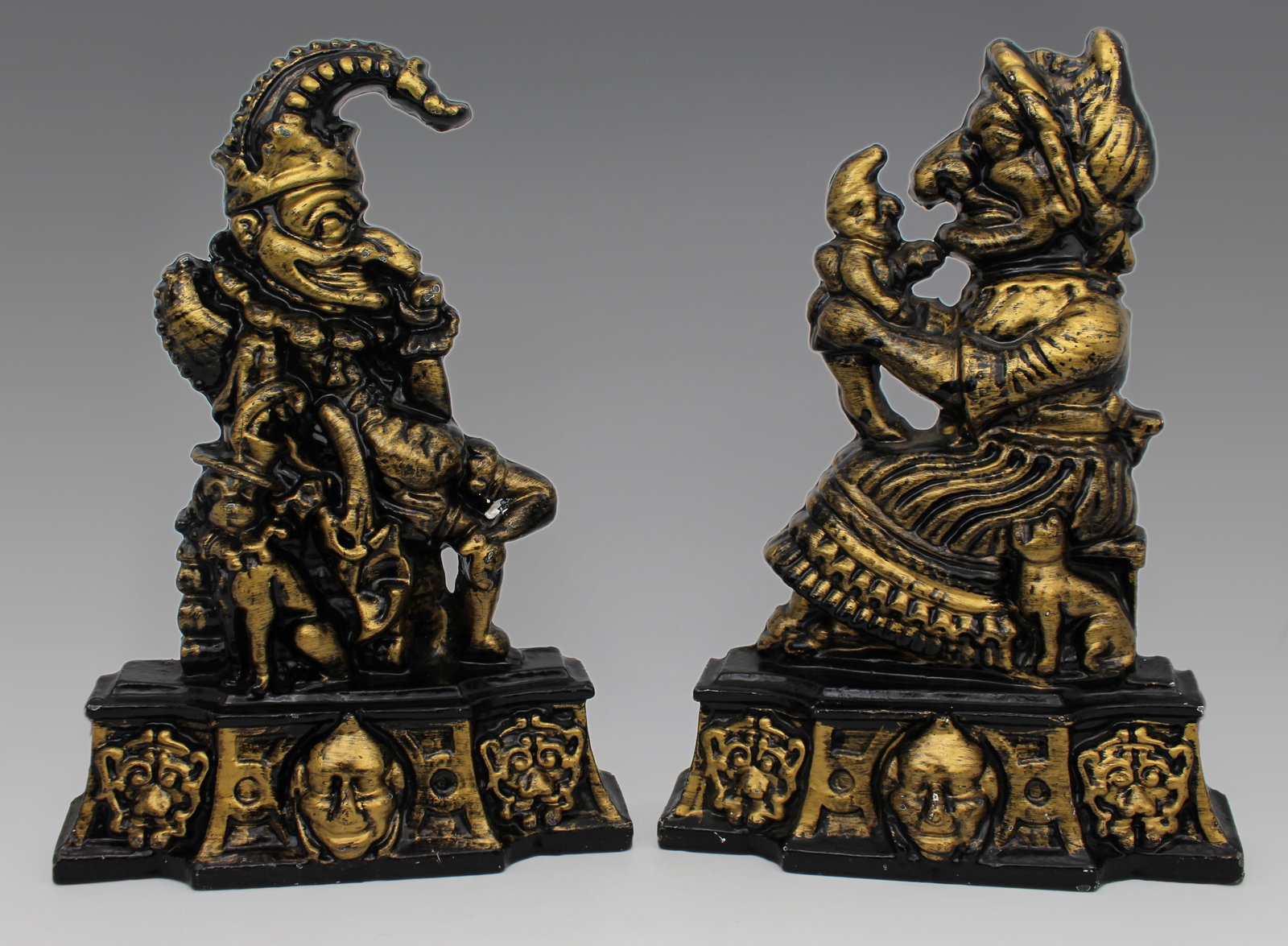 Vintage Cast Iron Punch & Judy Door Stops: Title: Vintage Cast Iron Punch & Judy Door Stops Description: Pair of Vintage Cast Iron Punch and Judy Doorstops Painted Black and Gold Finish | c. Mid-20th Century A charming and highly
