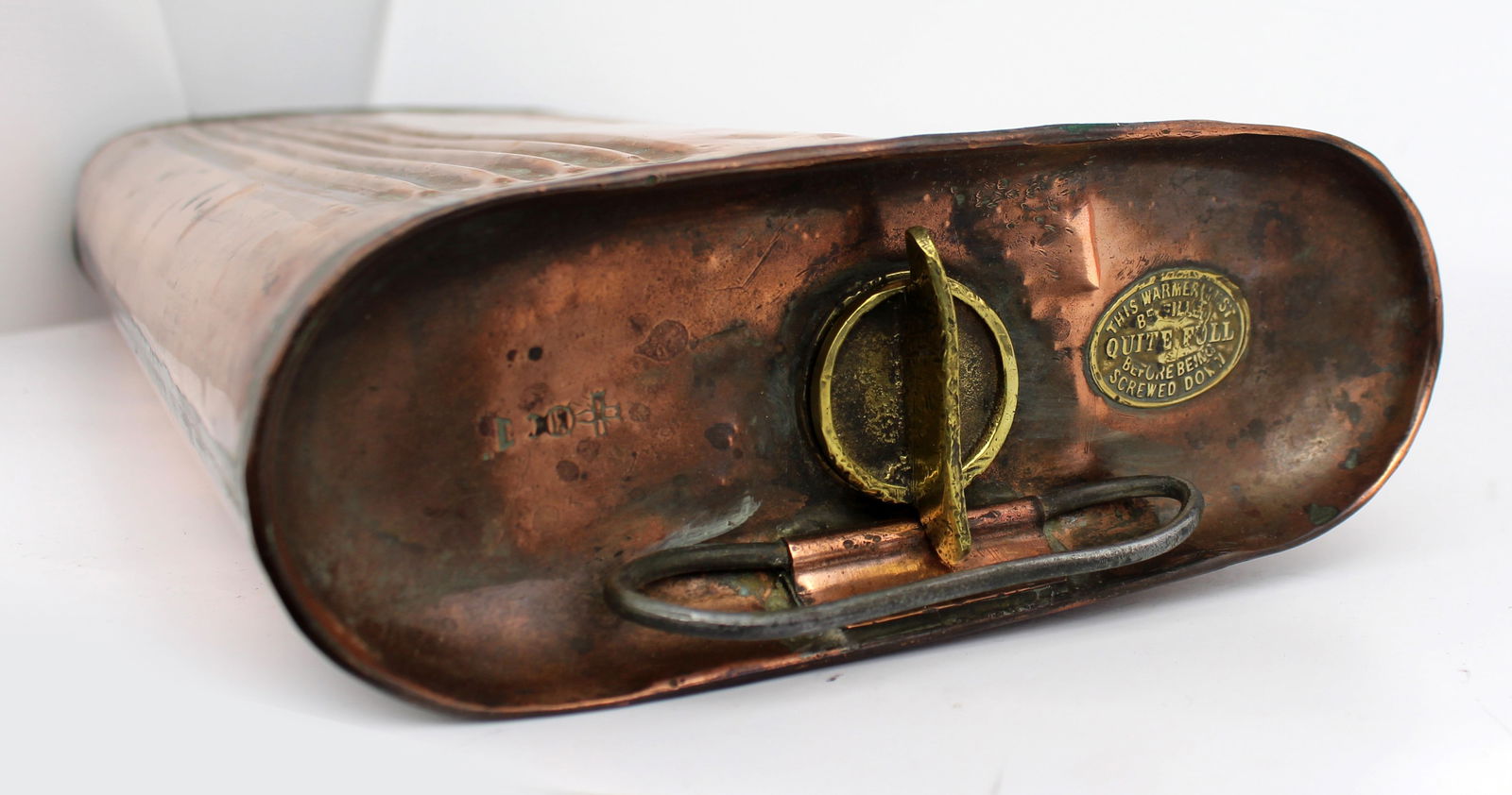 Antique Copper Warmer: Title: Antique Copper Warmer Description: Large Antique Copper Warmer Antique Copper body, handle, brass screw cap. Brass plaque reads "This warmer must be filled quite full before being
