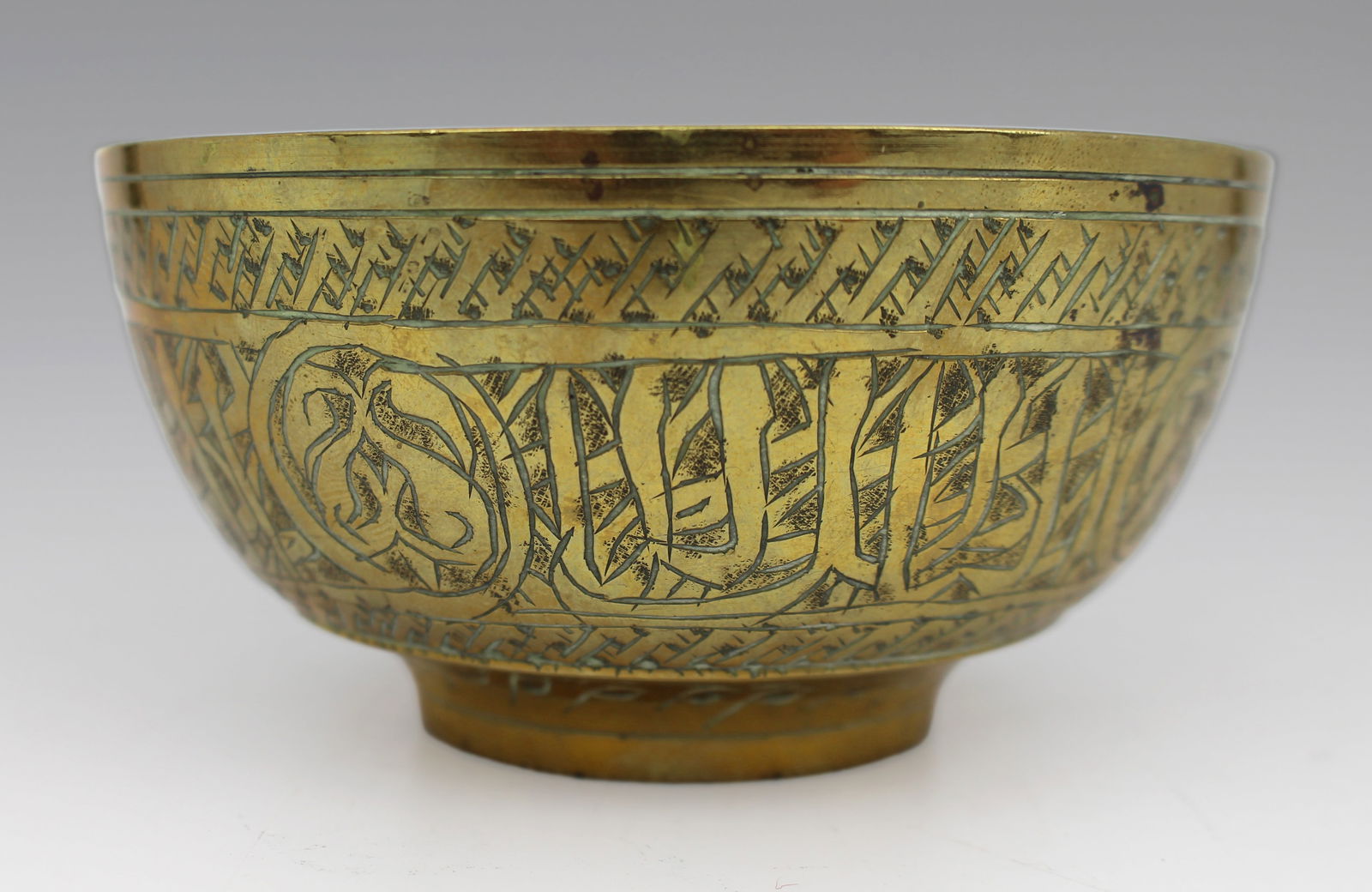 Engraved Islamic Brass Bowl with Calligraphic Decoration: Title: Engraved Islamic Brass Bowl with Calligraphic Decoration Description: Engraved Islamic Brass Bowl with Calligraphic Decoration Possibly Middle Eastern or Central Asian, late 19th to early