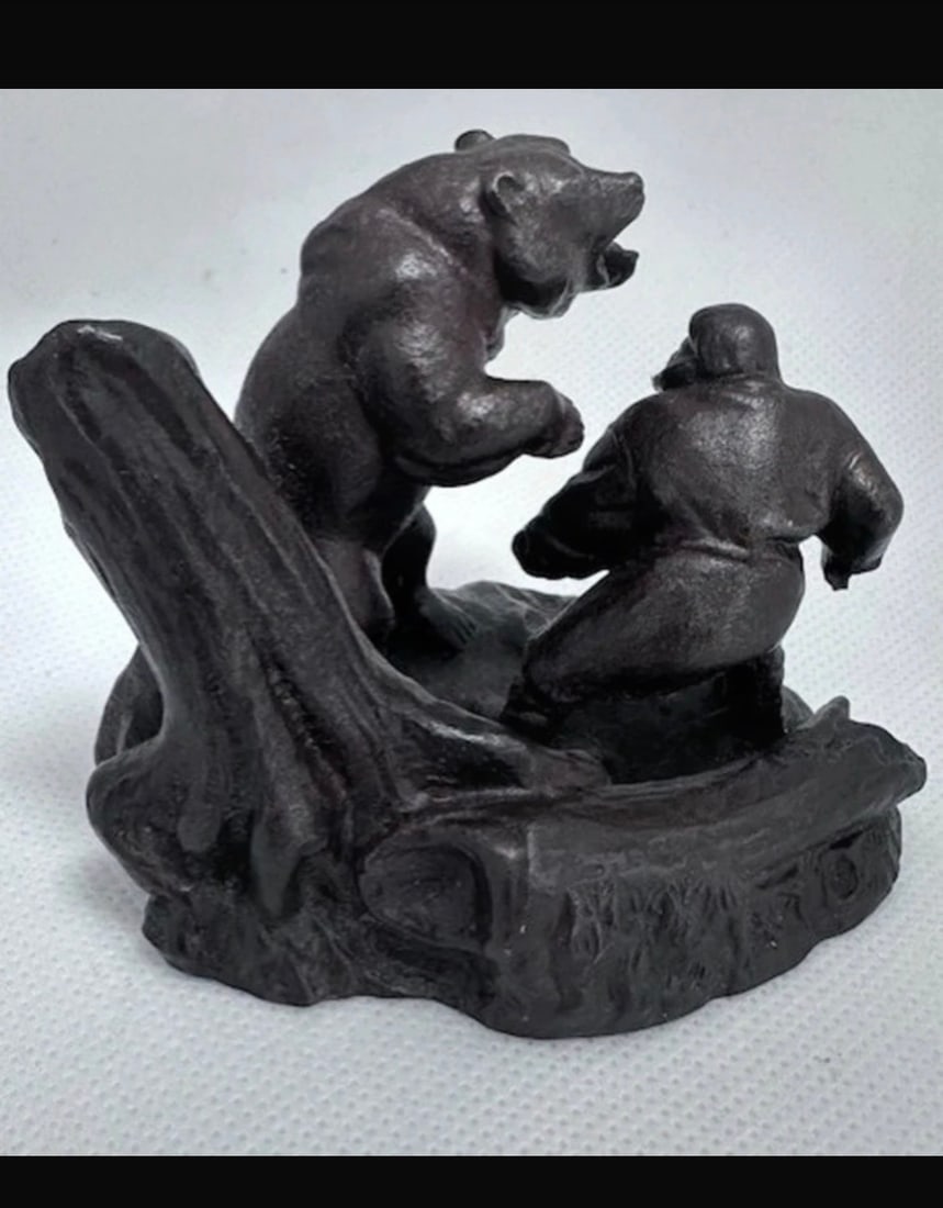 Vintage Bronze Bear & Hunter Figurine: Title: Vintage Bronze Bear & Hunter Figurine Description: Vintage sculpture depicts an intense encounter between a bear and a hunter Made from a sturdy, dark toned material, the sculpture