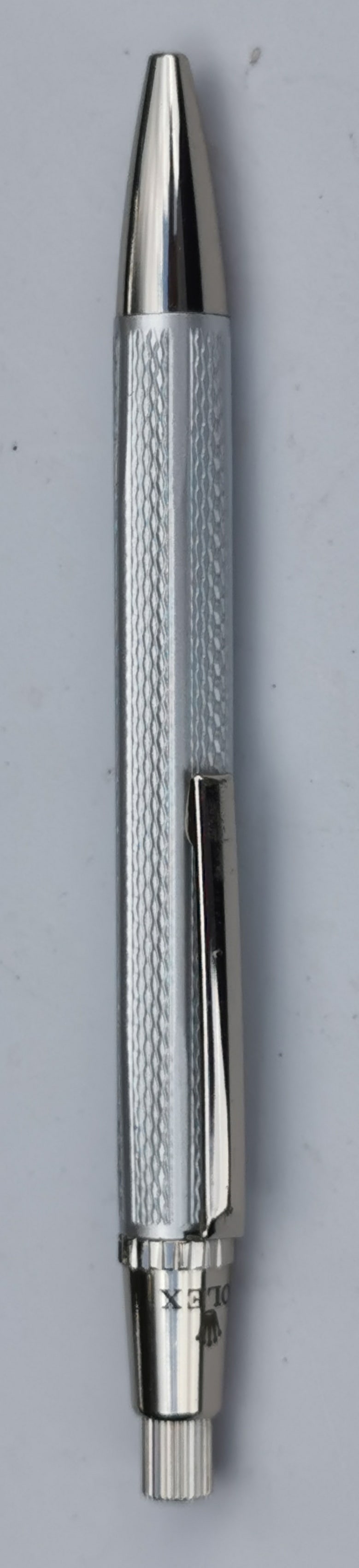Rolex Ballpoint Pen: Title: Rolex Ballpoint Pen Description: Rolex Ballpoint Pen Beautiful silver-tone metal pen with Rolex branding and logo. It has a nice textured grip and a polished finish. 