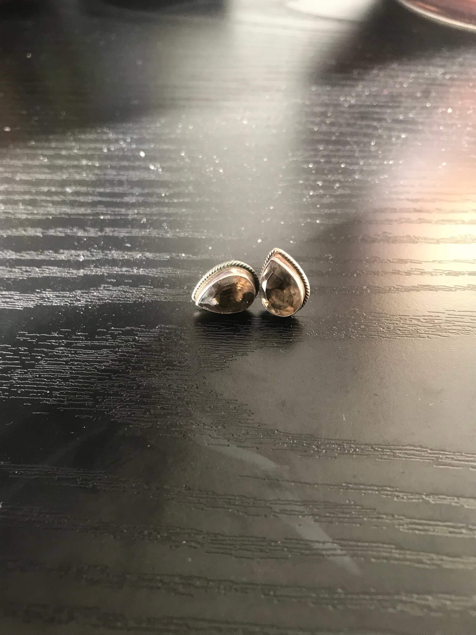 Smoky Quartz Sterling Silver Stud Earrings: Title: Smoky Quartz Sterling Silver Stud Earrings Description: Teardrop shape Smokey quartz stud earrings. 925 sterling silver. Very tiny nick on one of the quartz. Condition: