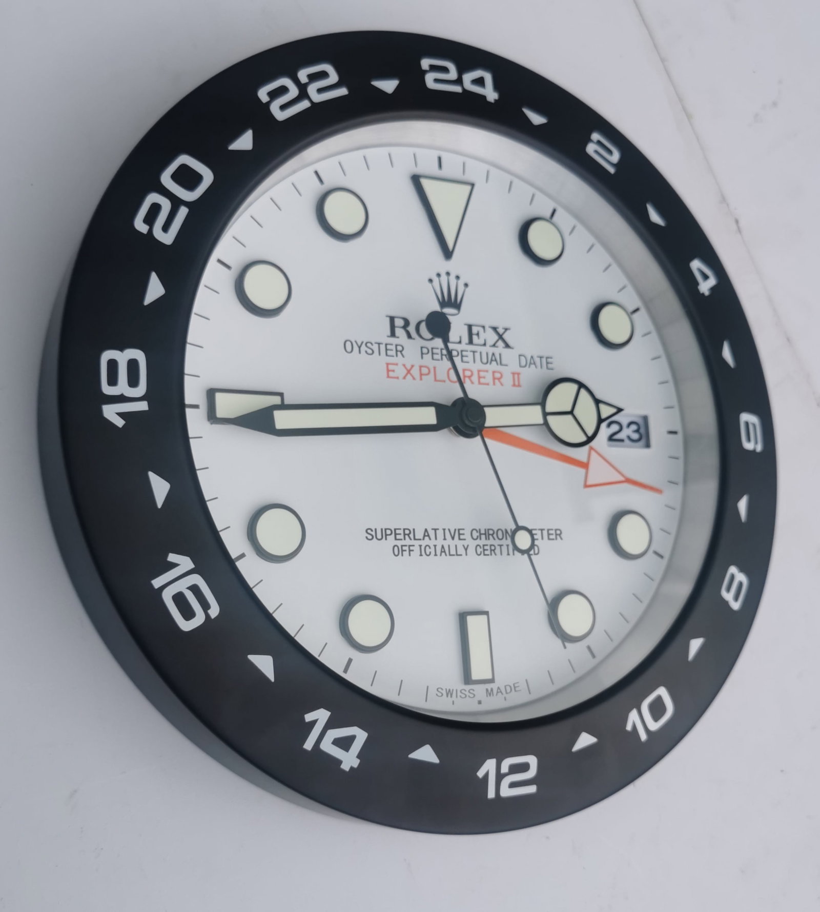 Rolex Explorer II Inspired Wall Clock – White Dial / Black Bezel: Title: Rolex Explorer II Inspired Wall Clock – White Dial / Black Bezel Description: Rolex Explorer II Inspired Wall Clock – White Dial / Black Bezel Elevate your space with this st