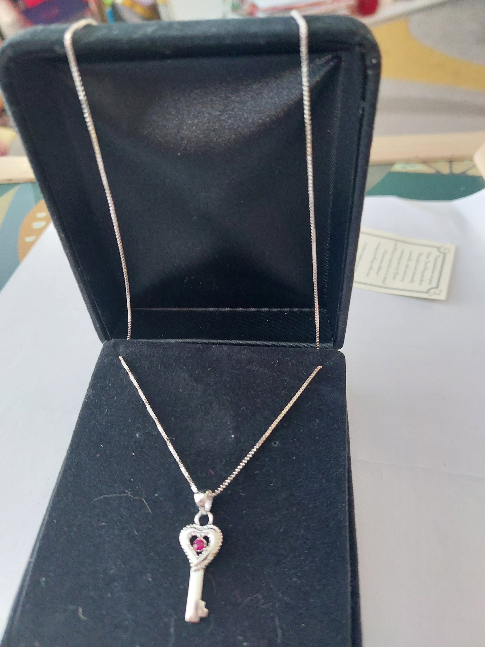 Key Pendant With Red Stone and Chain: Title: Key Pendant With Red Stone and Chain Description: Key pendant with red stone, complete with chain. Condition: New Delivery option: Collection & Delivery Location: ME13 Category: