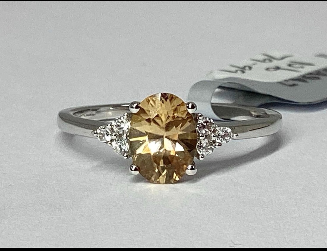 9ct White Gold 1.52ct Ceylon & White Zircon Dress Ring, N1/2: Title: 9ct White Gold 1.52ct Ceylon & White Zircon Dress Ring, N1/2 Description: The Genuine Gemstone Company A 9ct White gold 1.52 ct Ceylon & White Zircon dress ring, oval claw