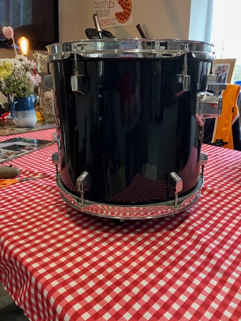 Wine Bottle Holder/Drum: Title: Wine Bottle Holder/Drum Description: Exterior is black and burgundy wood on the top. Contains four wine or champagne bottles Some small scratches on the sides but hardly noticeable&n