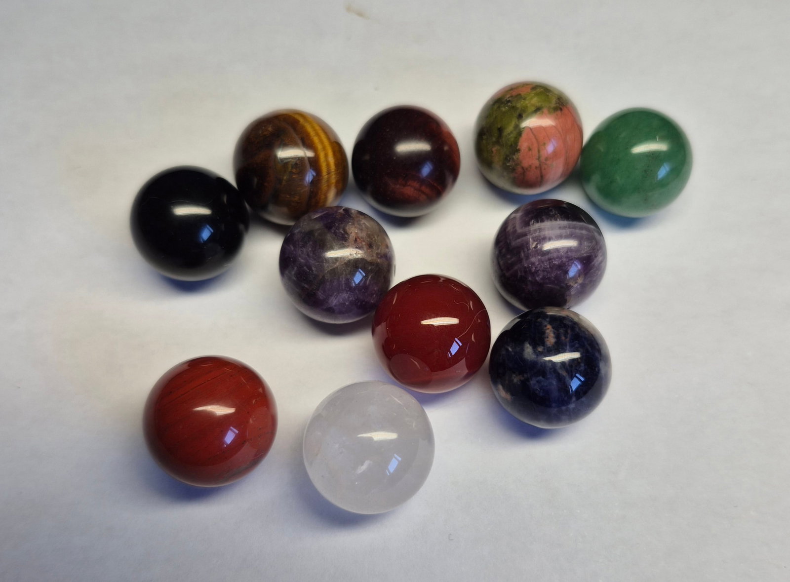 Natural Gemstone Spheres 15mm – Mixed Stones Collection: Title: Natural Gemstone Spheres 15mm – Mixed Stones Collection Description: Set of 11 polished gemstone spheres, approximately 15mm in diameter each. Includes a variety of natural stones
