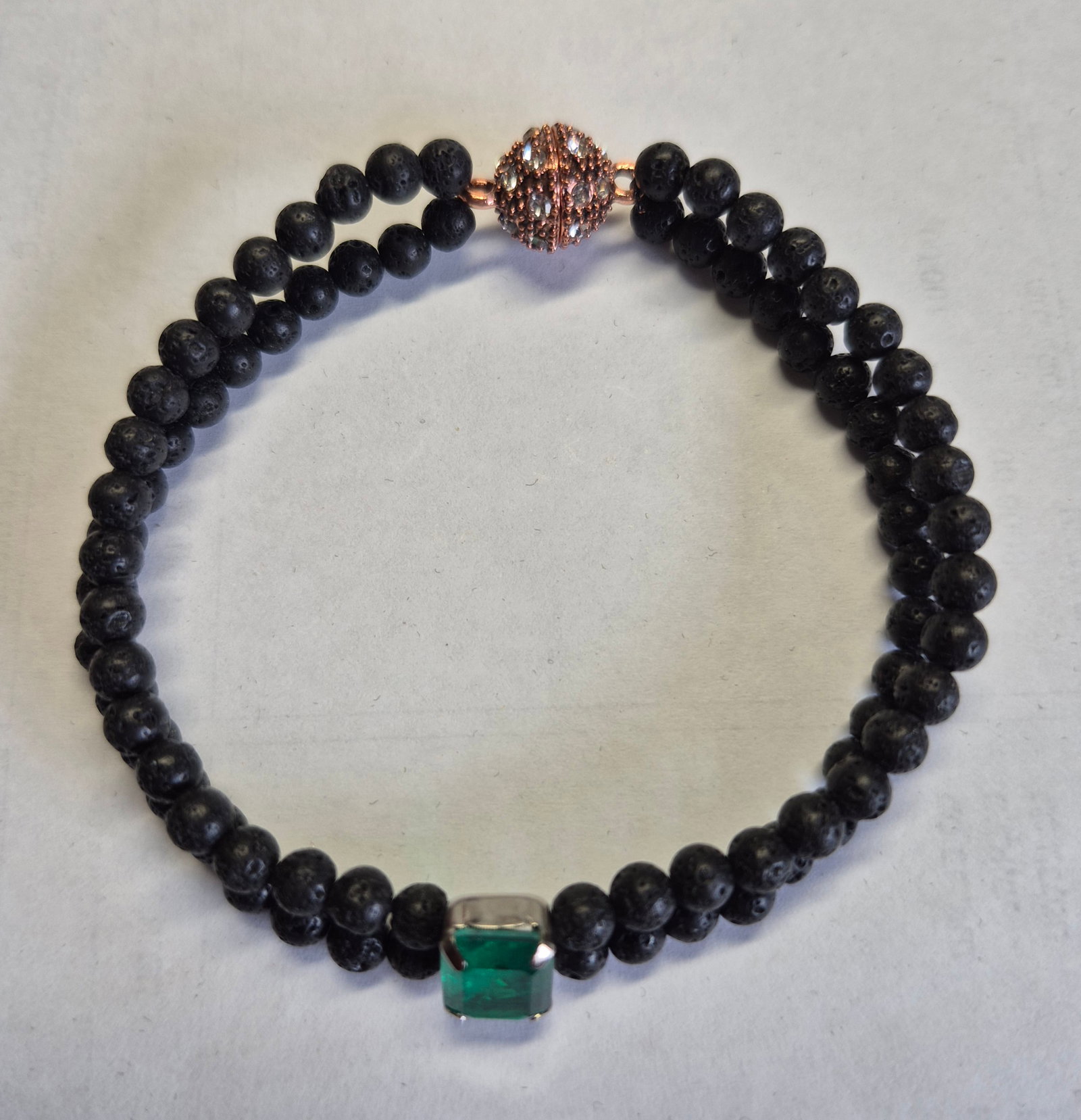 Emerald Doublet & Black Lava Stone Bracelet With Magnetic Clasp – 19 cm: Title: Emerald Doublet & Black Lava Stone Bracelet With Magnetic Clasp – 19 cm Description: Elegant handmade bracelet featuring natural black lava stone beads and a vibrant emerald-green