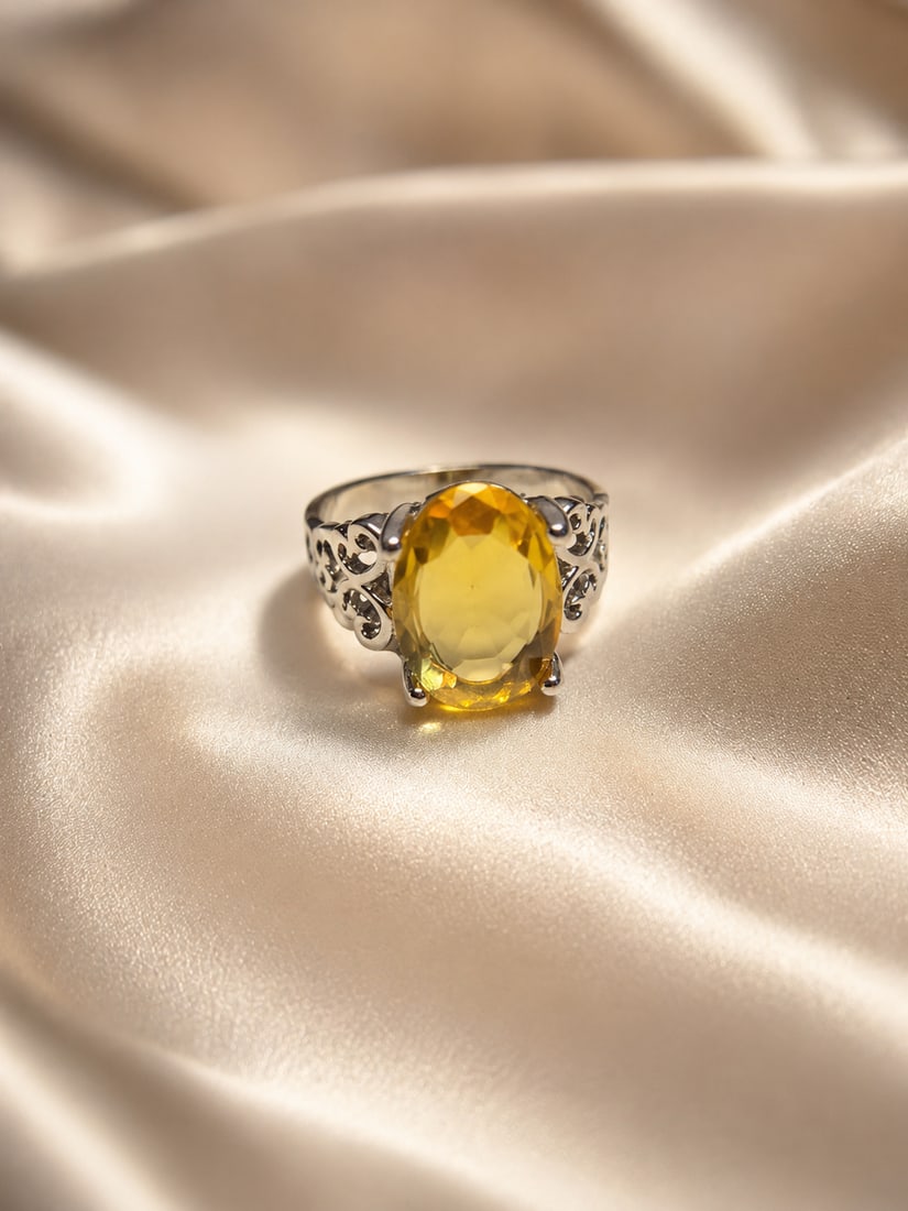 Silver Plated Ring With Synthetic Citrine – Oval Cut Yellow Gemstone: Title: Silver Plated Ring With Synthetic Citrine – Oval Cut Yellow Gemstone Description: Attractive silver-plated ring featuring a large oval-cut synthetic citrine gemstone with a vibrant