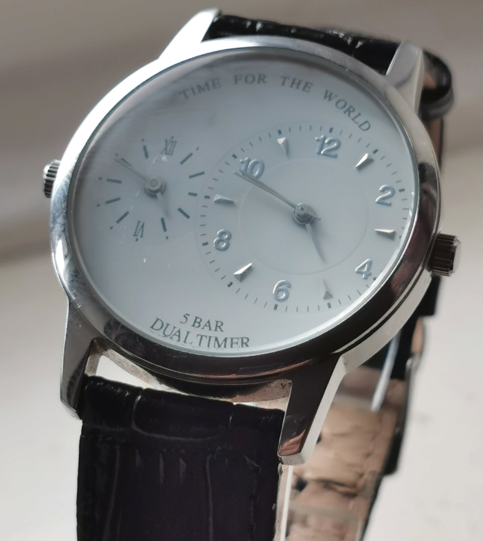 Vintage TCM Tchibo "Time For The World" Dual Timer Watch: Title: Vintage TCM Tchibo "Time For The World" Dual Timer Watch Description: A Vintage TCM (Tchibo Certified Merchandise) dual time zone men's wristwatch with a polished stainless steel round
