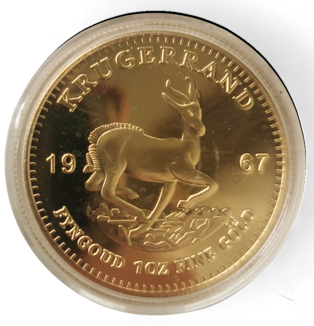 Gold-Plated 1967 South African Krugerrand Coin – First Year of Issue: Title: Gold-Plated 1967 South African Krugerrand Coin – First Year of Issue Description: Gold-plated 1967 South African Krugerrand coin, housed in a clear protective plastic capsule. It
