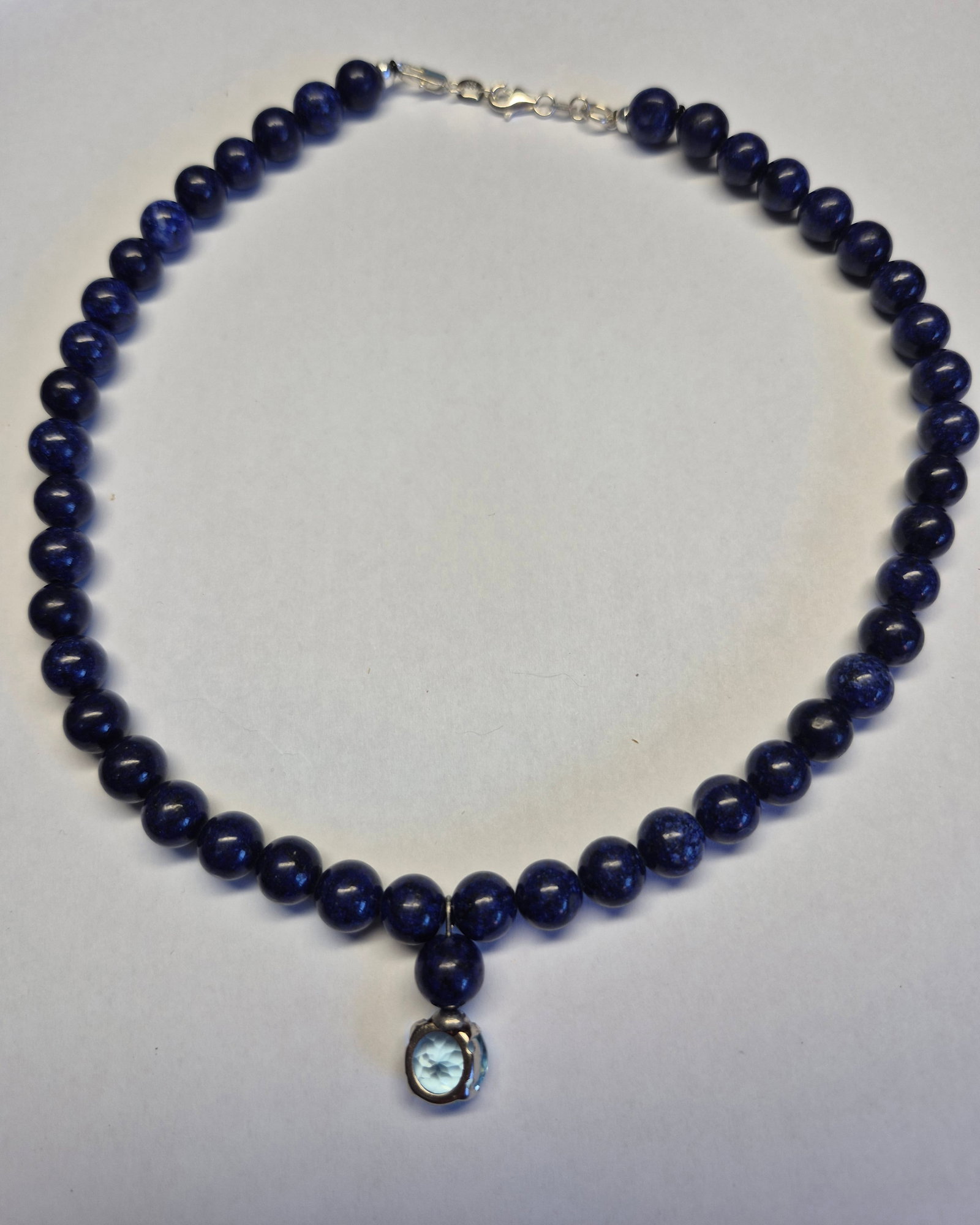 Natural Lapis Lazuli Necklace With 4.86 Ct Blue Topaz Pendant, 925 Sterling Silver Clasp, 39 cm: Title: Natural Lapis Lazuli Necklace With 4.86 Ct Blue Topaz Pendant, 925 Sterling Silver Clasp, 39 cm Description: Elegant handmade necklace crafted from genuine deep-blue lapis lazuli beads, feat
