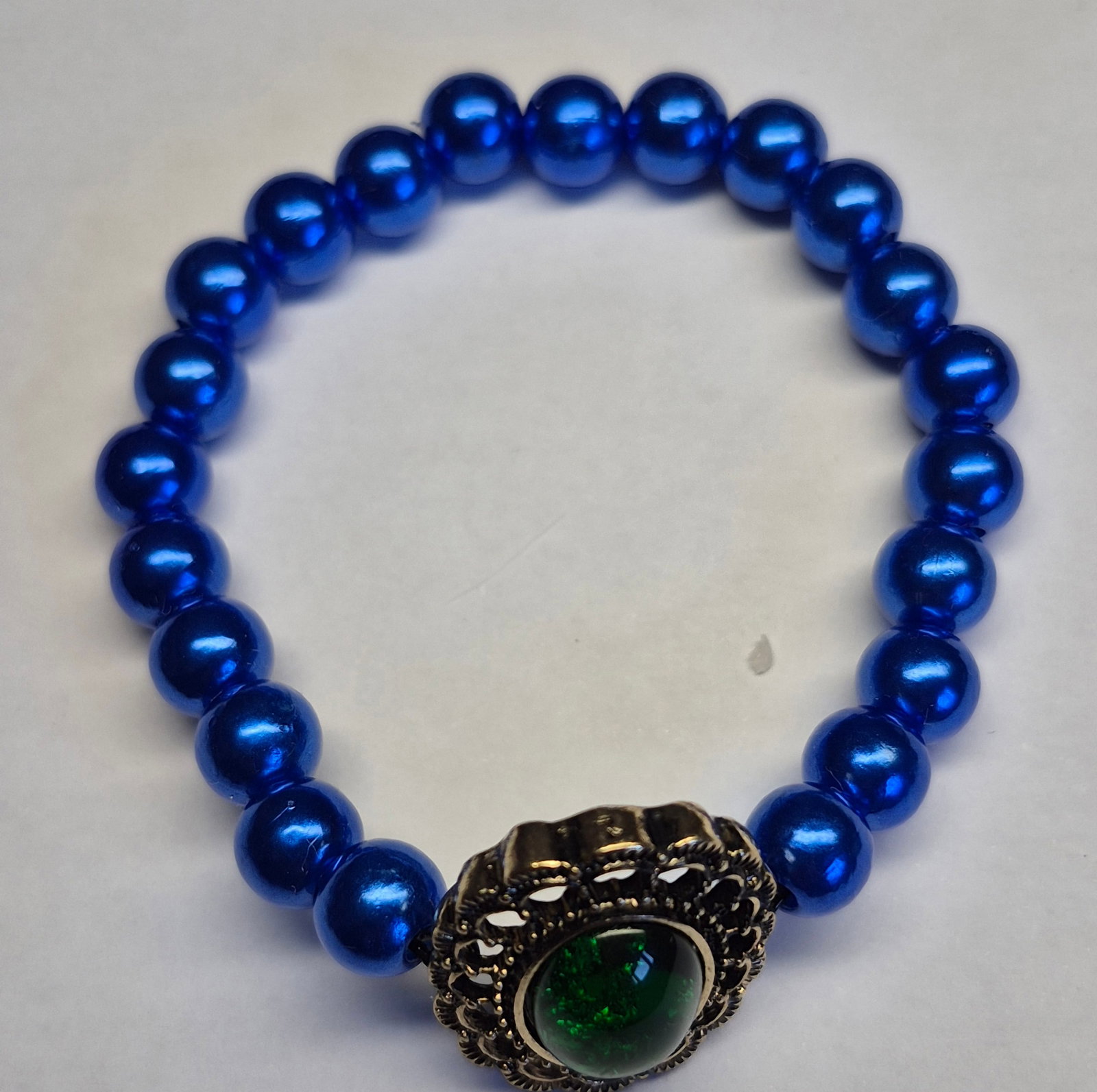 Royal Blue Elastic Bead Bracelet With Green Cabochon Centrepiece (1 of 3)