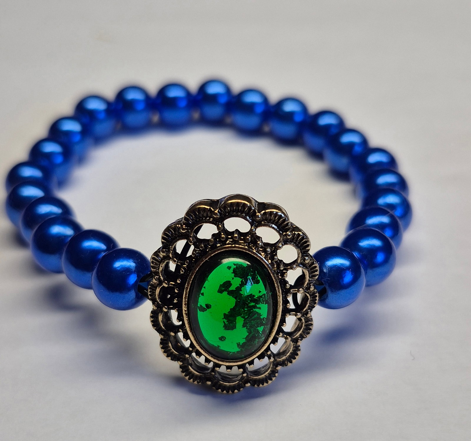 Royal Blue Elastic Bead Bracelet With Green Cabochon Centrepiece - 3