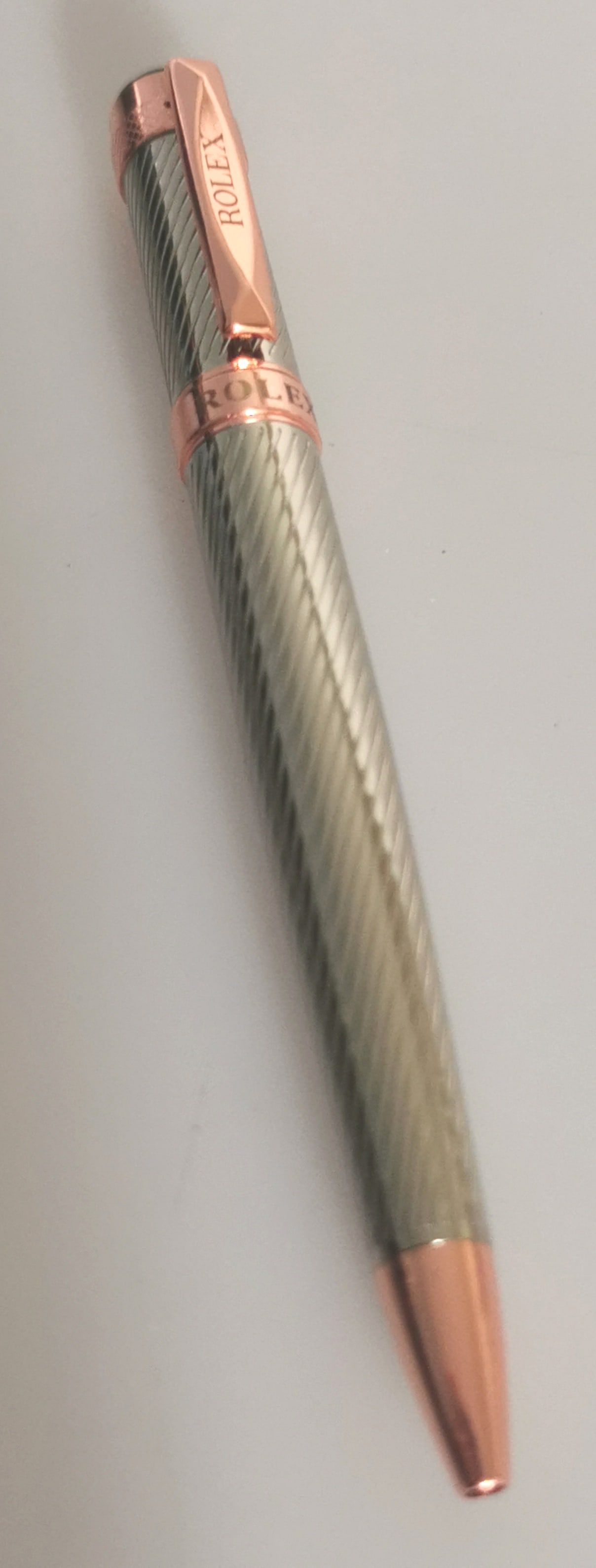 Executive Style Rolex-Branded Twist Ballpoint Pen - Rose Gold & Silver Finish: Title: Executive Style Rolex-Branded Twist Ballpoint Pen - Rose Gold & Silver Finish Description: Add a touch of prestige to your desk or everyday carry with this elegant executive ballpoint