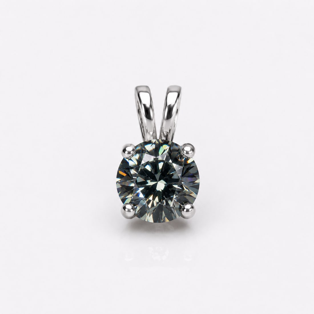 Certified 2 Ct Grey Moissanite Pendant In Sterling Silver 925: Title: Certified 2 Ct Grey Moissanite Pendant In Sterling Silver 925 Description: Elegant solitaire pendant featuring a stunning 2.00 carat round brilliant-cut grey moissanite, expertly set in