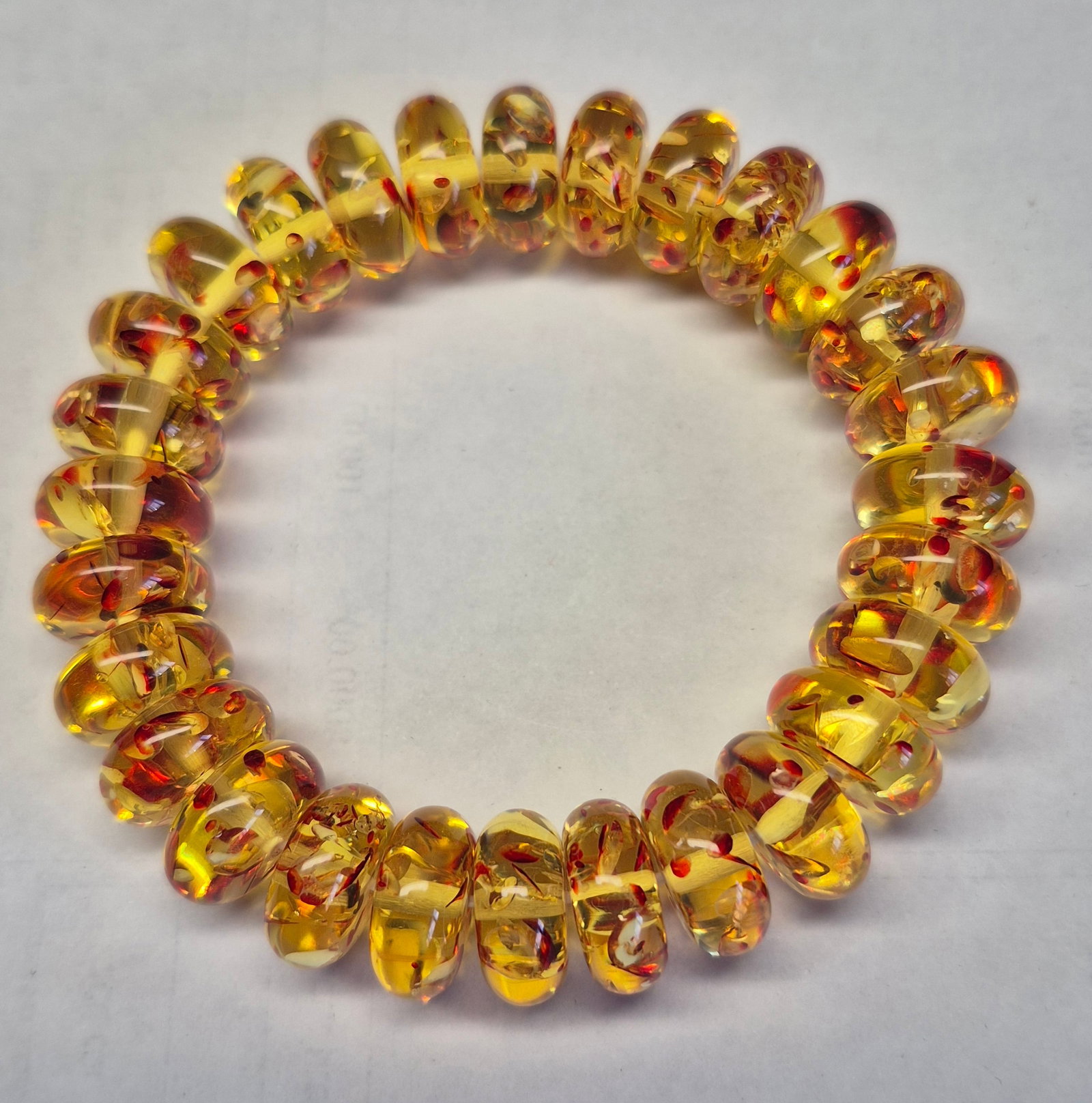 Amber-Look Resin Stretch Bracelet With Red & Gold Inclusions – Handmade Statement Jewellery: Title: Amber-Look Resin Stretch Bracelet With Red & Gold Inclusions – Handmade Statement Jewellery Description: Beautiful stretch bracelet crafted from translucent amber-tone resin beads