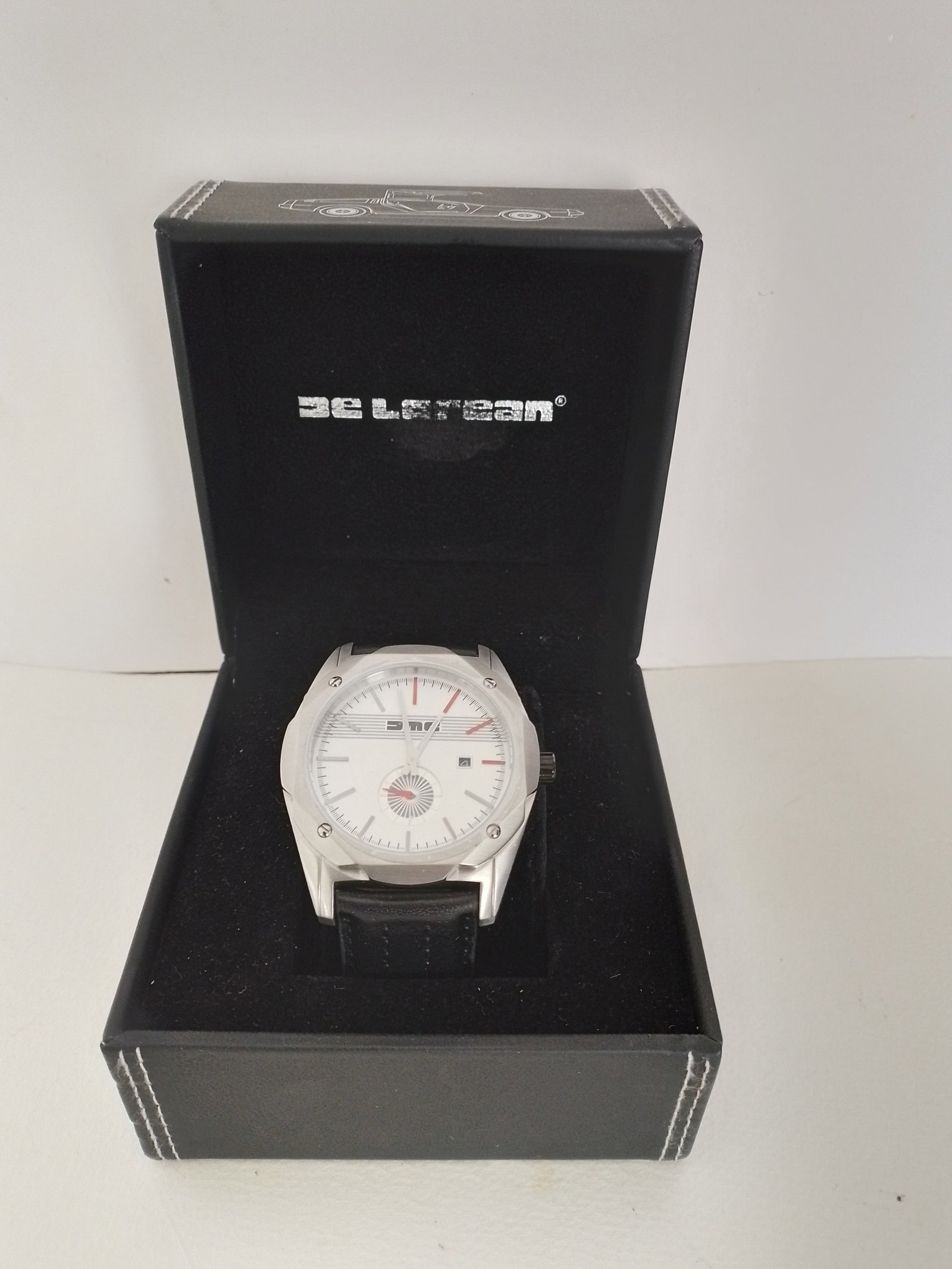 DeLorean Car Company Quartz Wrist Watch: Title: DeLorean Car Company Quartz Wrist Watch Description: This is a DeLorean Sports Car Company quartz watch in original box. As new With black leather wrist band Condition: New