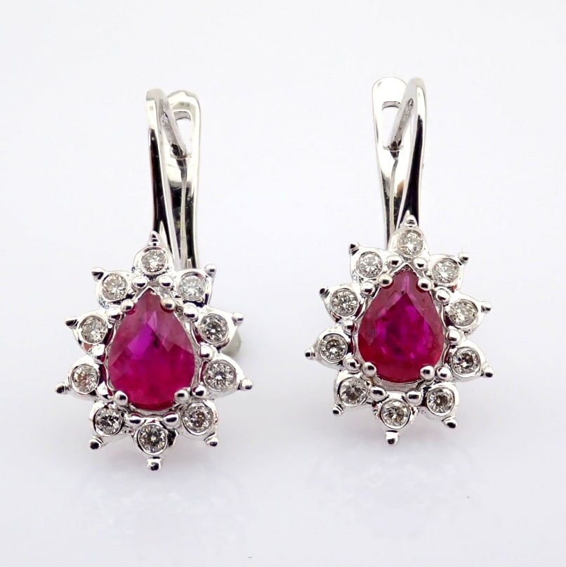 Natural Diamond 18K White Gold Earring: Title: Natural Diamond 18K White Gold Earring Description: 18K white gold cluster earrings, detailed with ruby and brilliant diamonds -------------------------------------------------- •