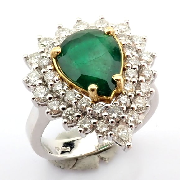 Natural Diamond 18K White Gold Ring: Title: Natural Diamond 18K White Gold Ring Description: 18K White gold cluster ring detailed with vibrant emerald and pear and brilliant diamonds ------------------------------------------------