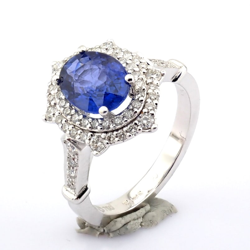 Natural Diamond 18K White Gold Ring: Title: Natural Diamond 18K White Gold Ring Description: An exquisite 18k white gold cluster ring detailed with sapphire and brilliant diamonds --------------------------------------------------