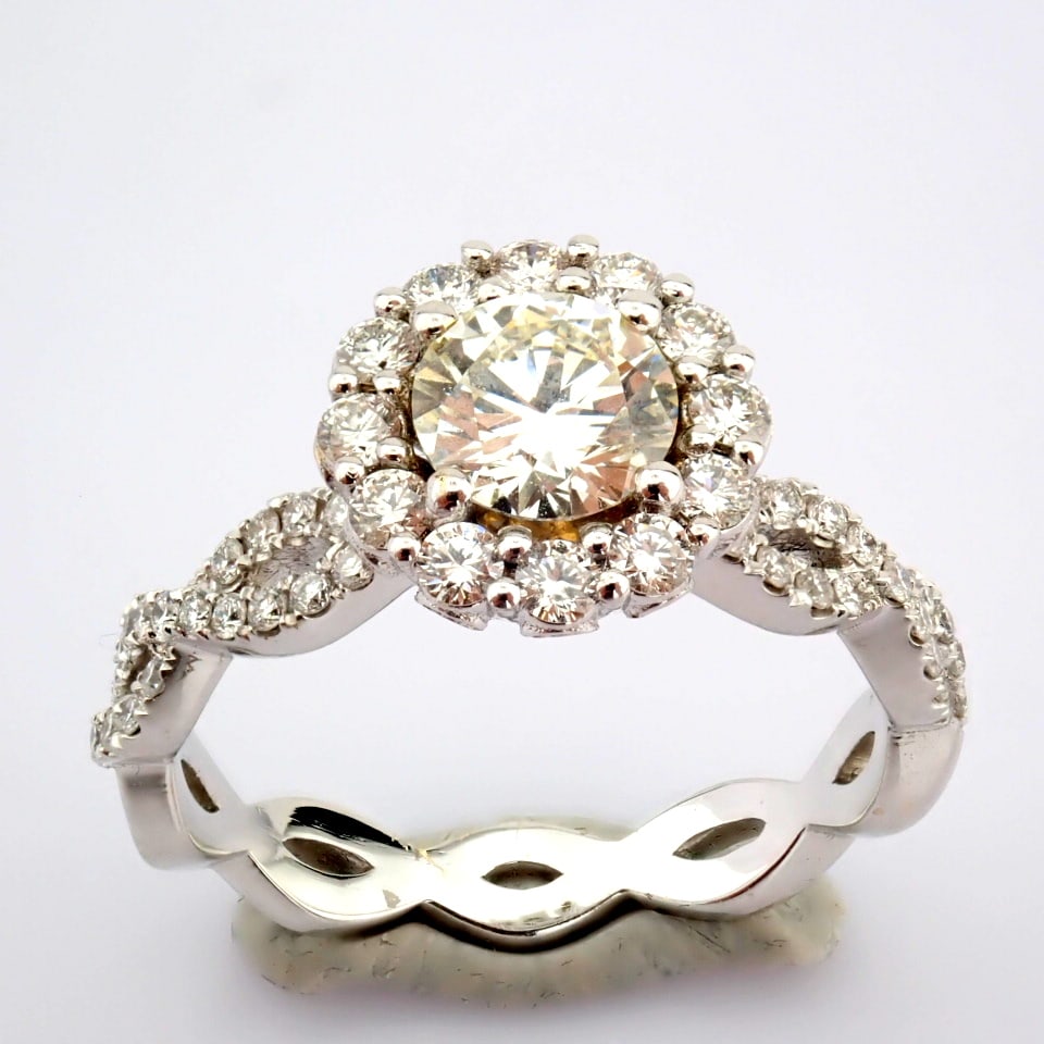 Natural Diamond 18K White Gold Ring: Title: Natural Diamond 18K White Gold Ring Description: An exquisite 18K gold ring with 1.33 ct brilliant diamonds. -------------------------------------------------- • METALS AND WEIGHTS